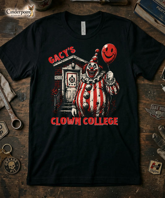 Top-down flat lay of a black Bella Canvas 3001 t-shirt with the 'Gacy's Clown College' creepy clown design on a rustic wooden workshop table with a wrench, spark plug, and vintage car club patches.