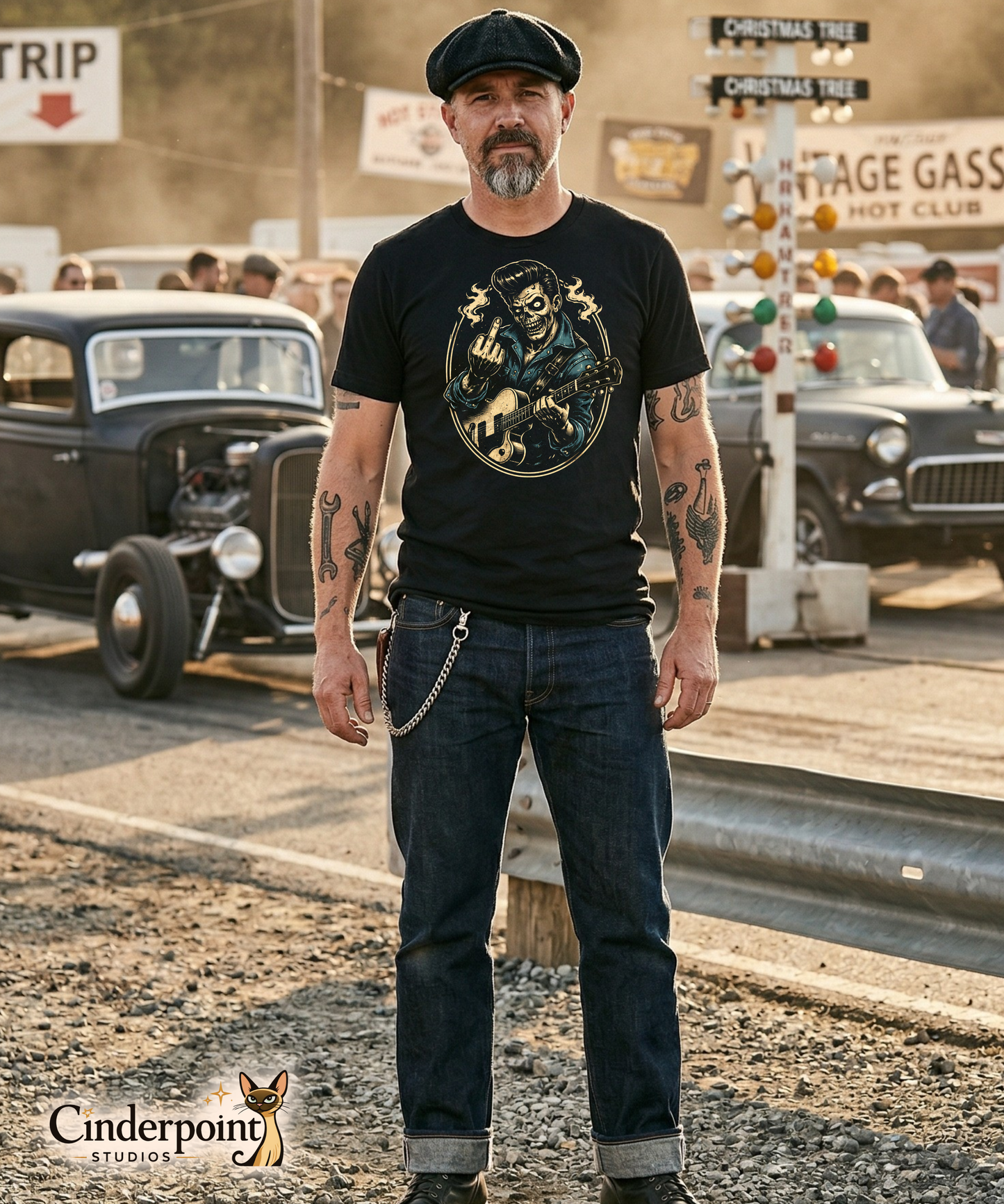 A man with tattoos and a flat cap wearing 'The Johnny Smash' rebel rockabilly tee. High-contrast undead 'King' graphic styled in a vintage drag strip setting. Authentic streetwear for the punk-rock, kustom kulture, and alternative community.