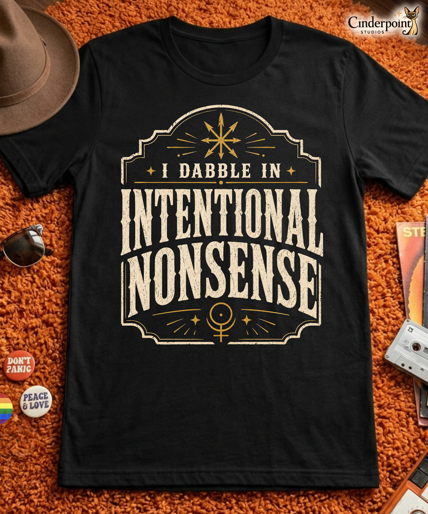 Intentional Nonsense t-shirt on black Bella Canvas tee with cream vintage typography and gold occult accents