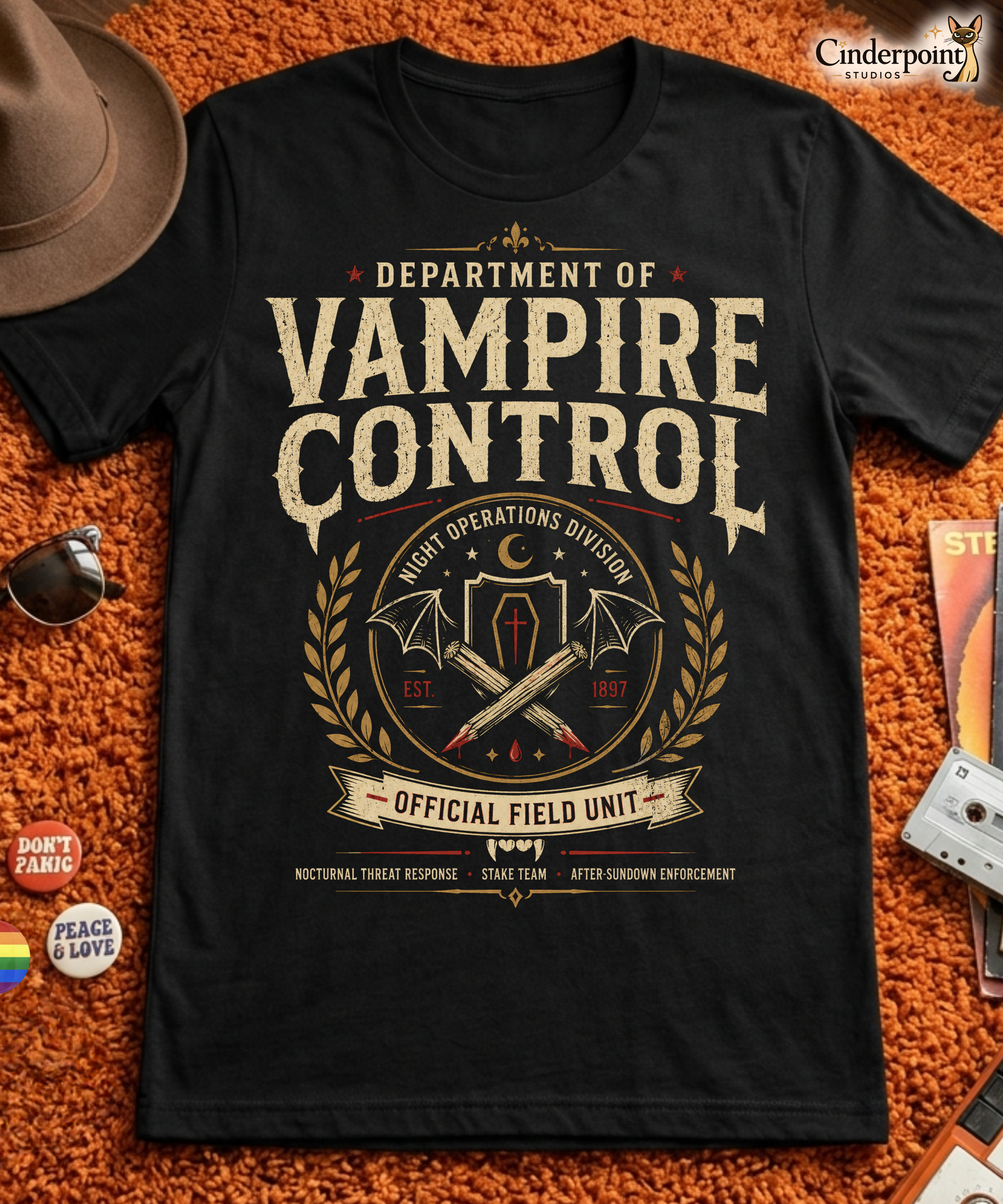 Department of Vampire Control t-shirt design with vintage gothic typography, crossed stakes, bat wings, coffin emblem, and official field unit text