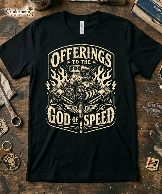 Black graphic tee featuring original Cinderpoint Studios artwork for Offerings to the God of Speed, a one-color retro gearhead design with a supercharged V8 engine, crossed pistons, winged spark plug, flames, lightning bolts, and vintage hot rod lettering.
