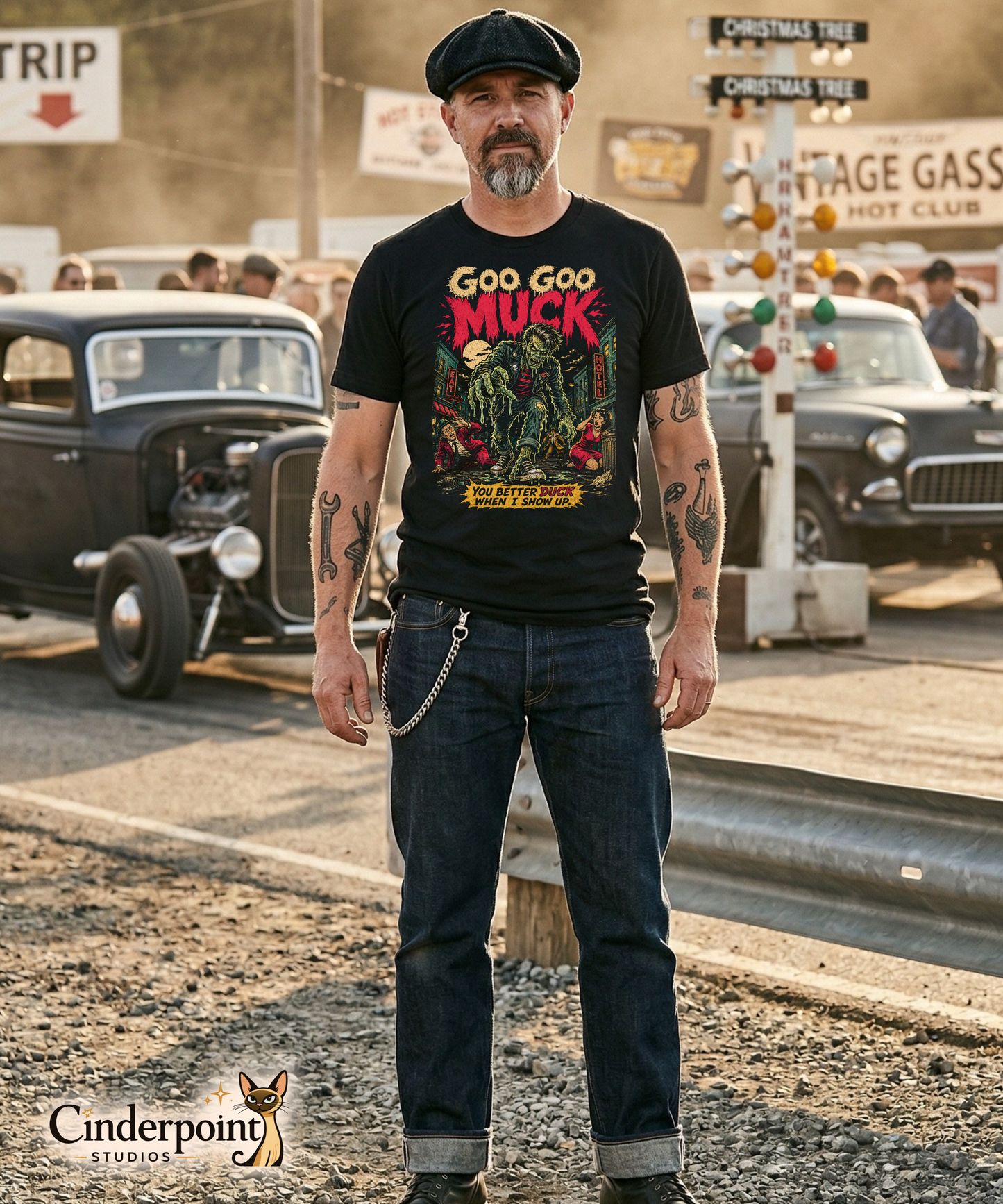 A retro-style graphic on a black t-shirt featuring a teenage monster with a pompadour, wearing a red and black striped shirt and a black leather jacket, with "GOO GOO MUCK" in distressed lettering.