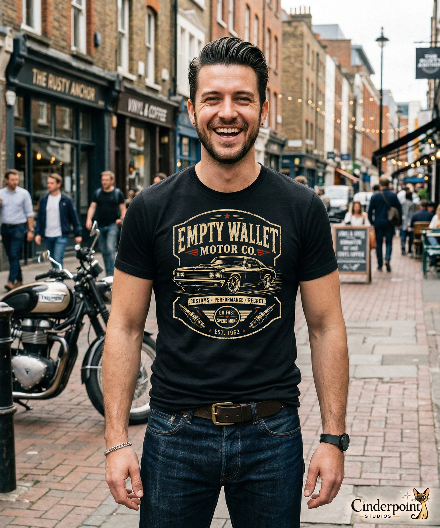 Black graphic tee featuring original Cinderpoint Studios artwork for Empty Wallet Motor Co., a funny retro garage design with a classic muscle car, bold vintage lettering, spark plug details, red accents, Customs Performance Regret text, and Go Fast Spend More slogan.