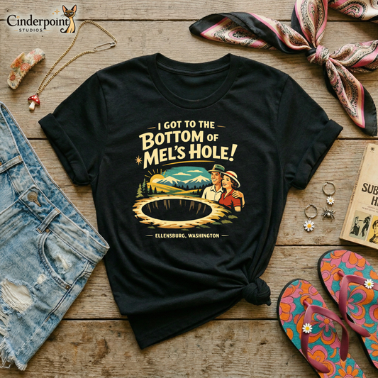 Black retro graphic t-shirt featuring a vintage travel-style illustration of smiling tourists beside a giant mysterious hole with the phrase I Got to the Bottom of Mel’s Hole and Ellensburg, Washington.