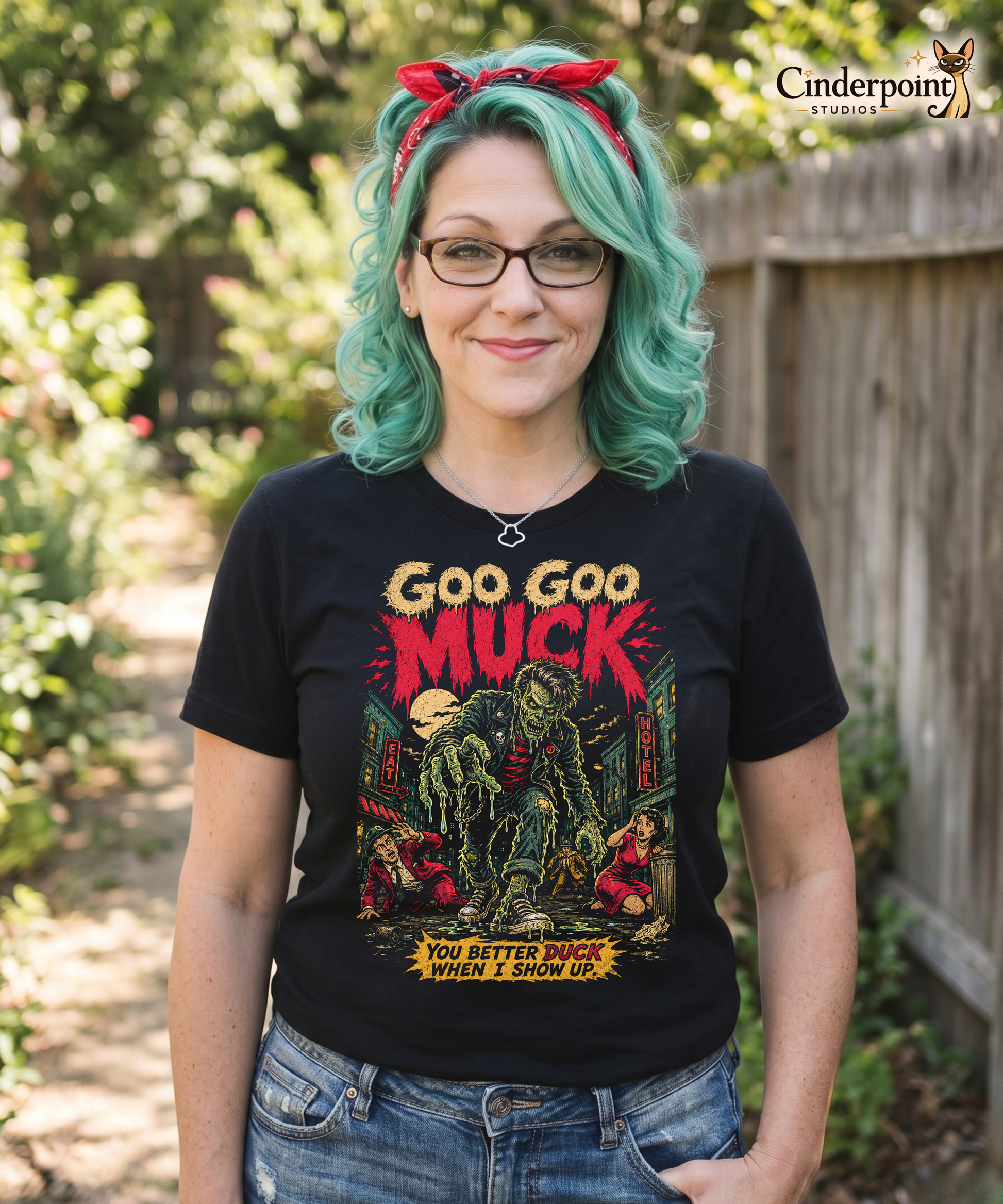 A retro-style graphic on a black t-shirt featuring a teenage monster with a pompadour, wearing a red and black striped shirt and a black leather jacket, with "GOO GOO MUCK" in distressed lettering.