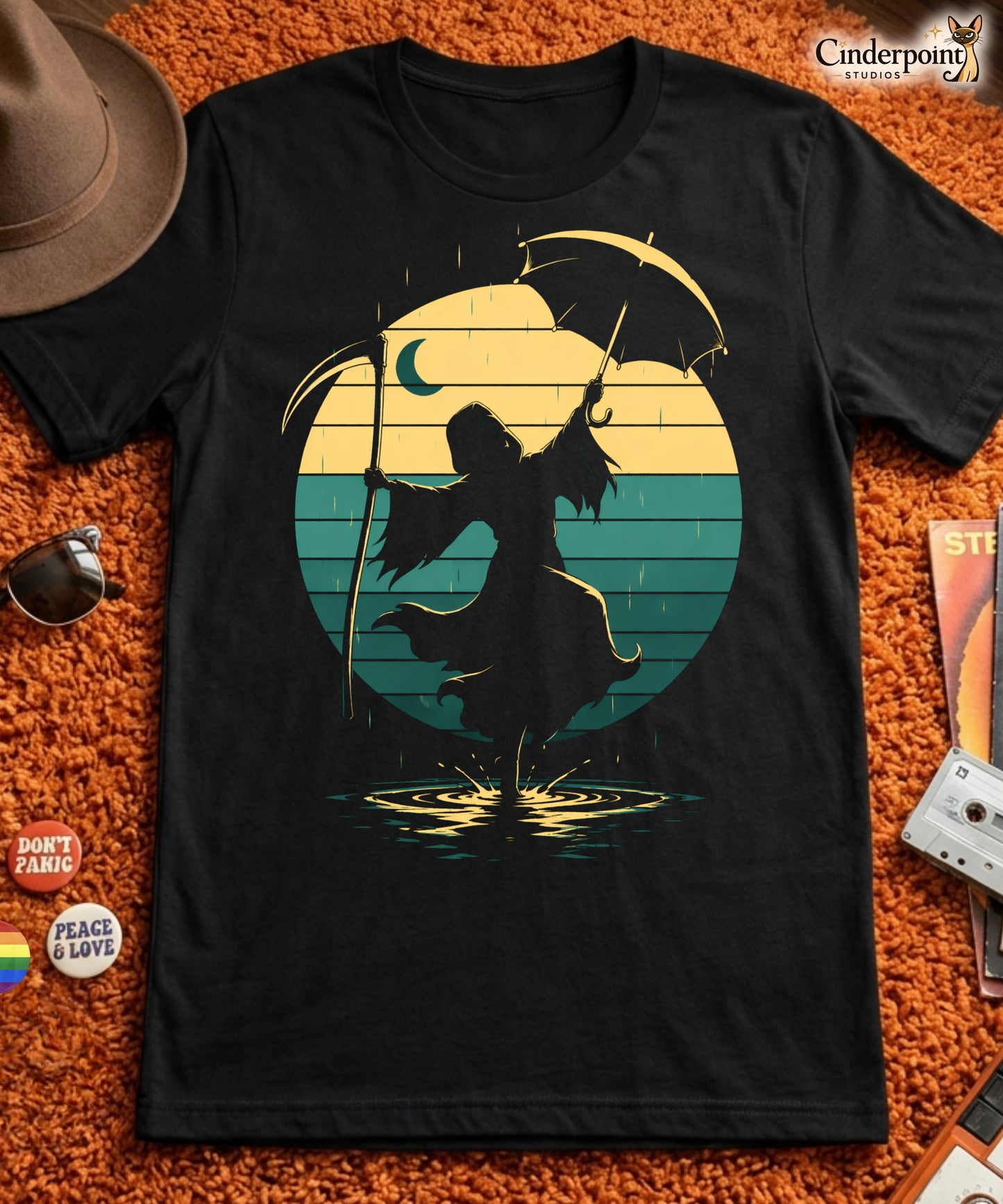 A retro-style graphic t-shirt featuring the Grim Reaper in a tuxedo and top hat, holding an umbrella and dancing in the rain against a vibrant 1980s sunburst backdrop.