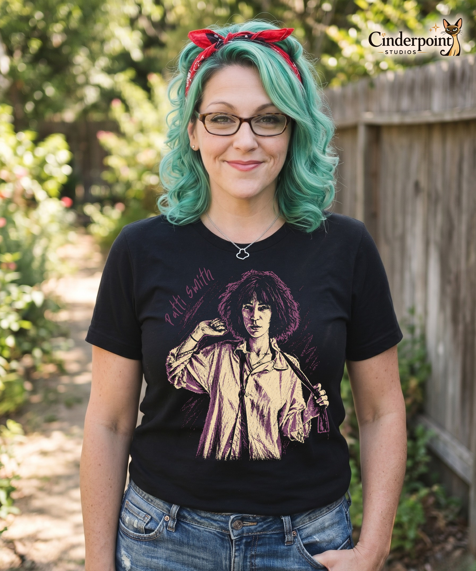 Auntie Mel wearing A gritty, high-contrast artistic portrait of Patti Smith on a black t-shirt, capturing her iconic 1970s punk poetess aesthetic.