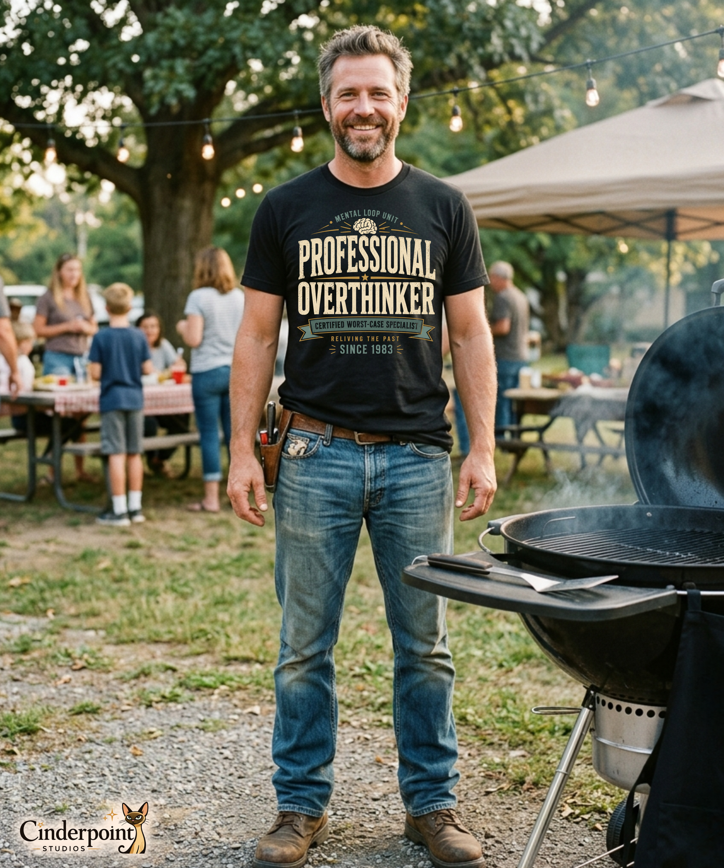 Male model wearing a black graphic tee with the Professional Overthinker design by Cinderpoint Studios, featuring retro badge-style lettering, a brain graphic, and Mental Loop Unit text.