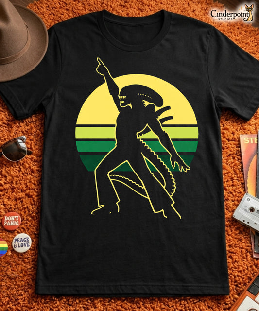 Black t-shirt with disco xenomorph alien graphic design on an orange textured surface