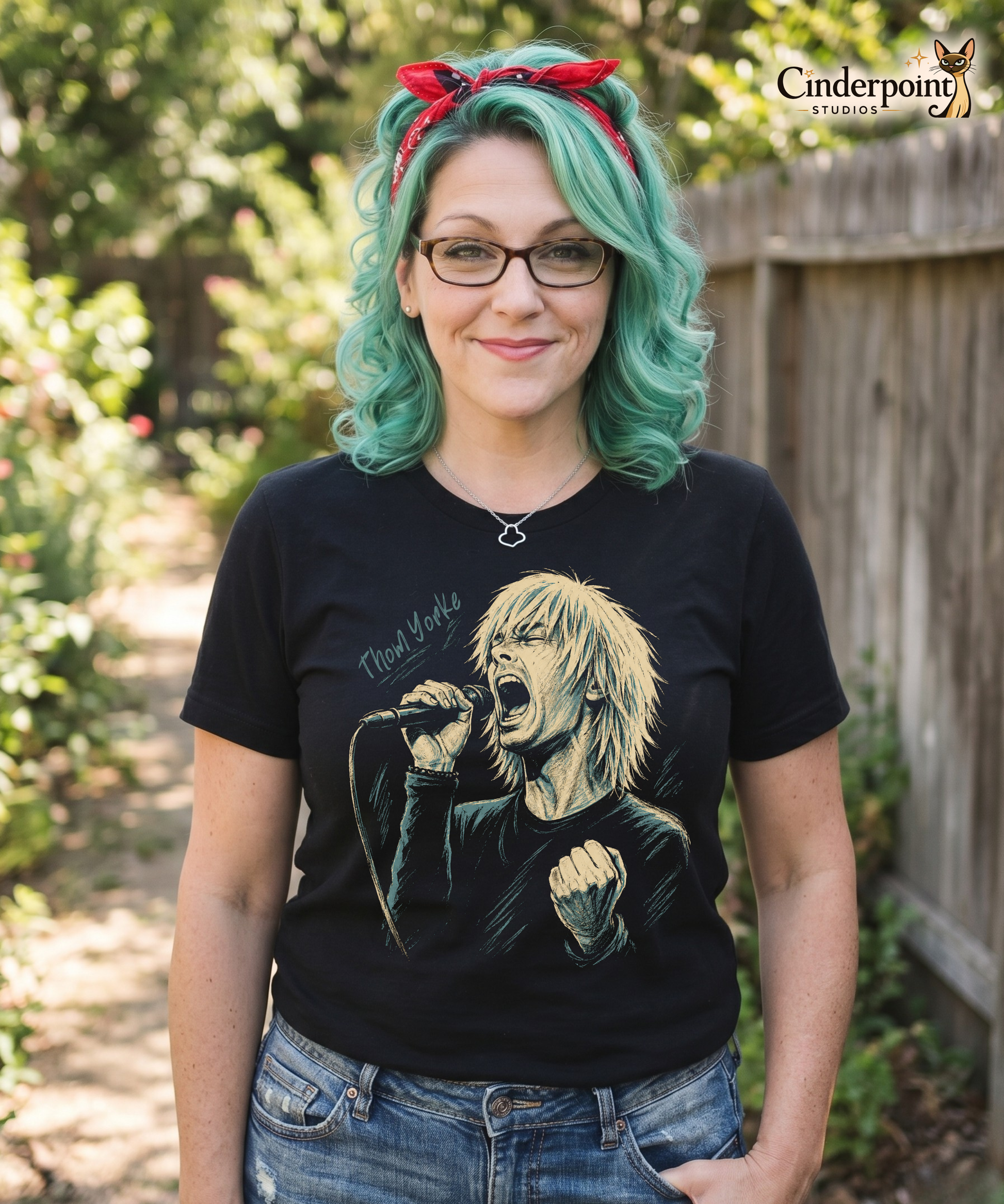 Auntie Mel, designer, wearing A stylized, high-contrast artistic portrait of Thom Yorke on a black t-shirt, capturing his iconic expressive features and indie rock aesthetic.