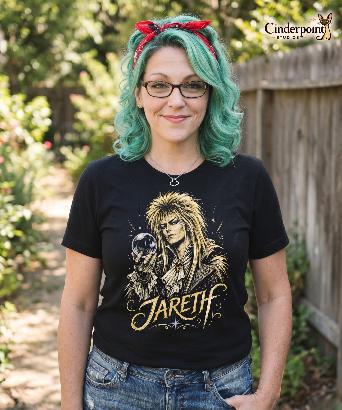 A gritty, high-contrast artistic portrait of Jareth the Goblin King on a black t-shirt, featuring his iconic 80s glam hair and a crystal ball with a starburst.