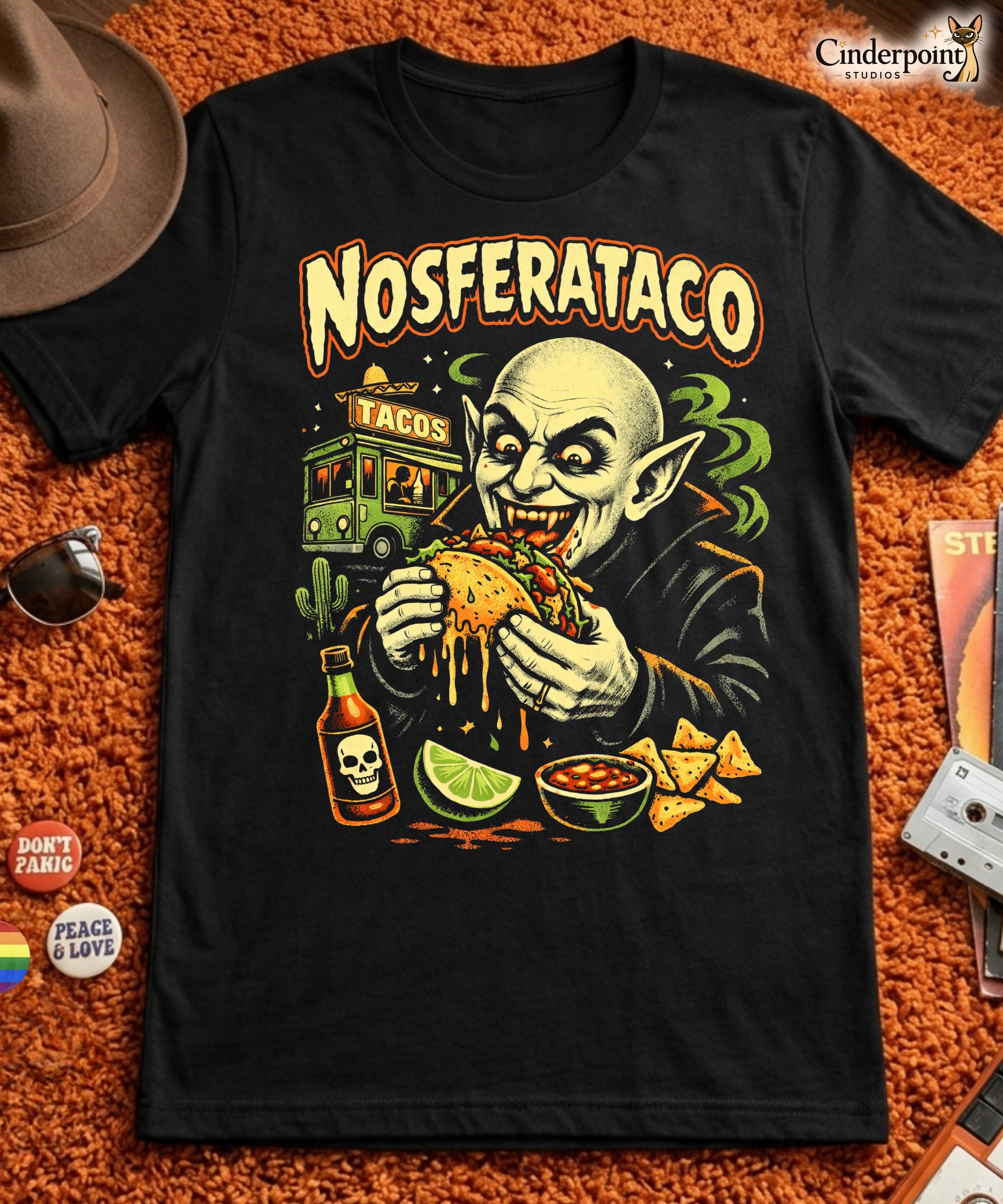A retro horror-style graphic t-shirt featuring the vampire Nosferatu holding a taco, with "Nosferataco" in stylized, campy cinematic lettering.