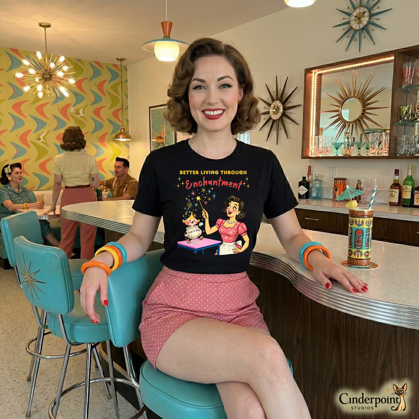 A cheerful woman with vintage styling wearing the Better Living Through Enchantment shirt at a mid-century modern tiki bar.