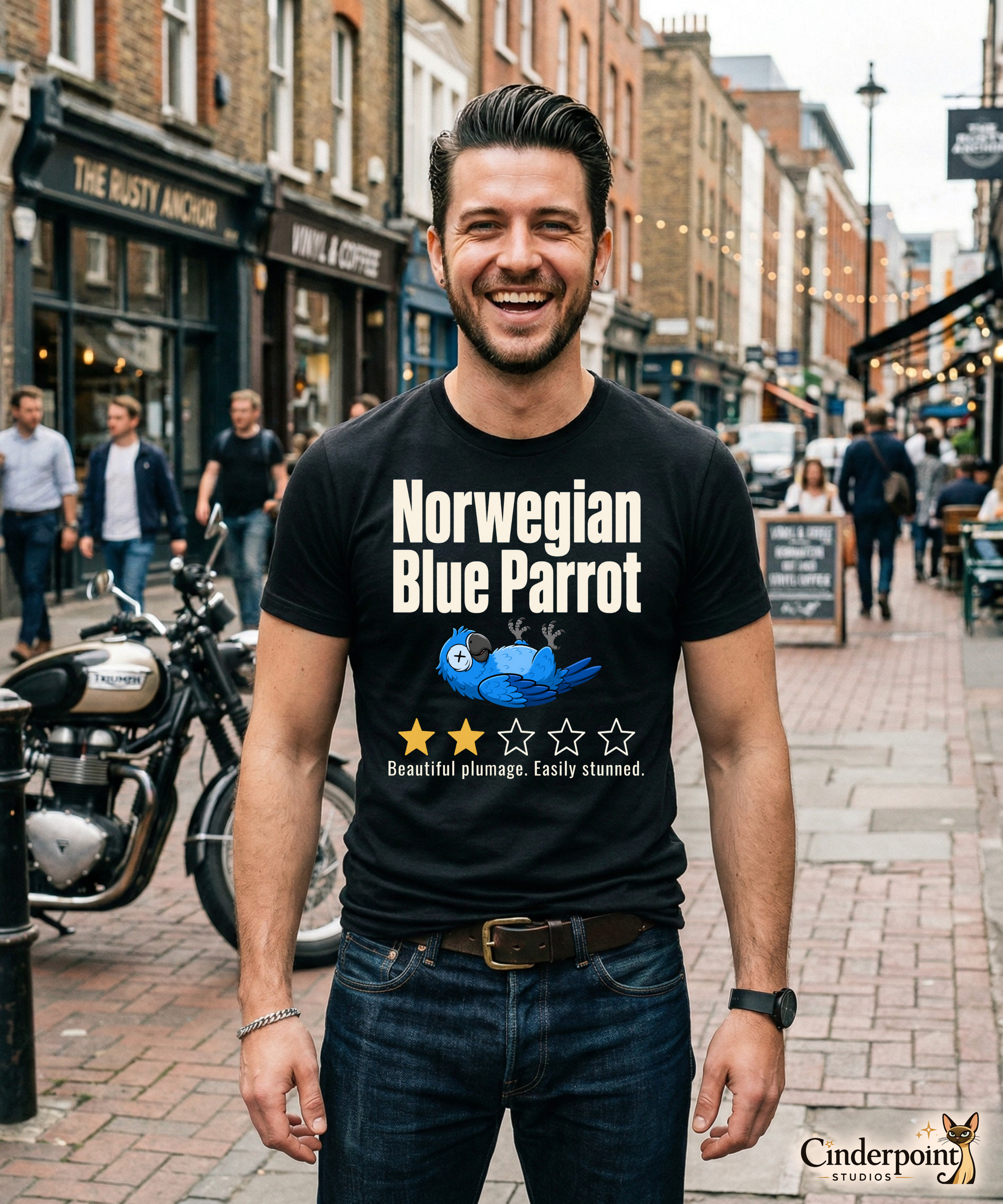 Funny blue parrot t-shirt design with two-star review text reading Beautiful plumage Easily stunned