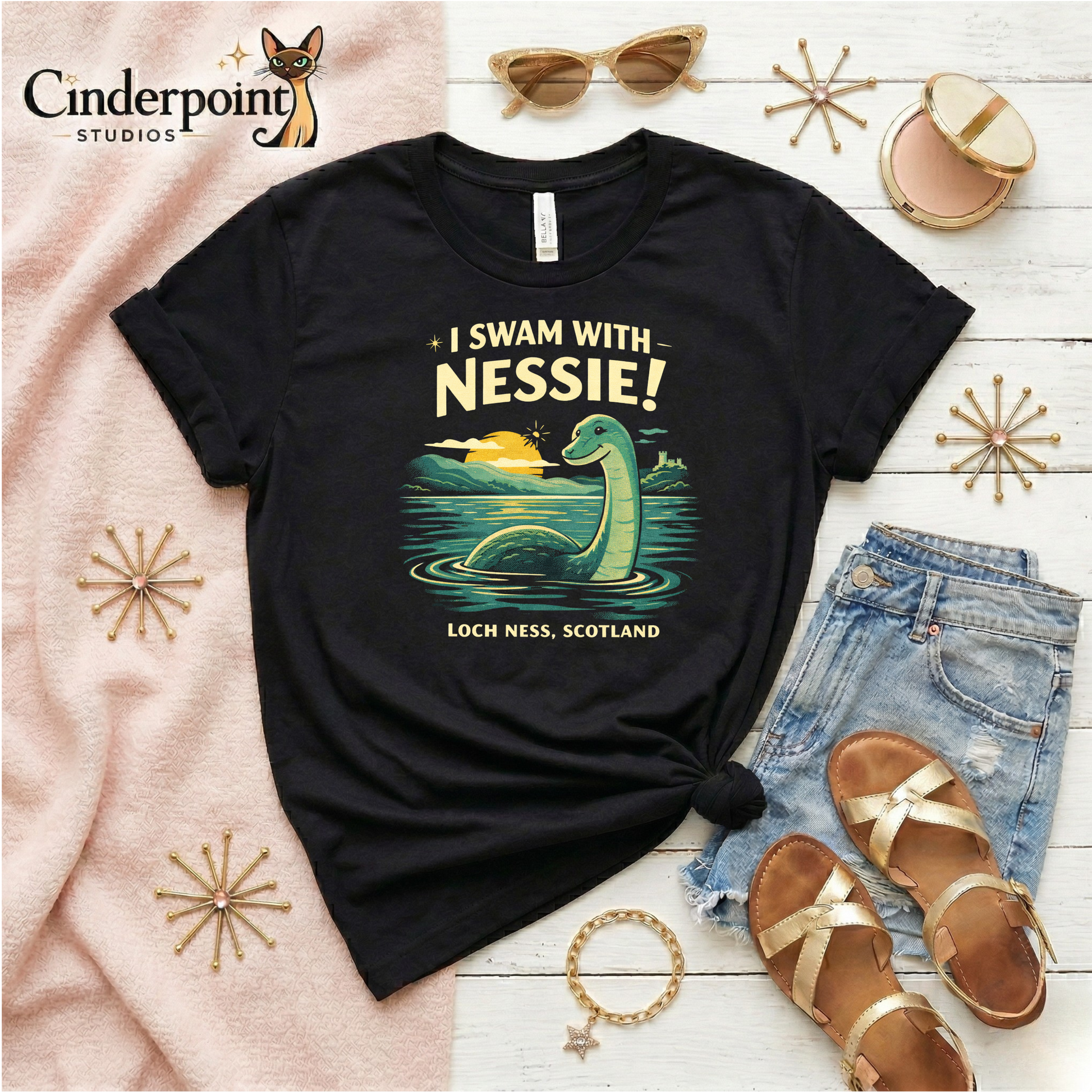A retro cryptid travel t-shirt featuring Nessie in Loch Ness, Scotland with scenic vintage-style artwork and playful souvenir-shirt charm.