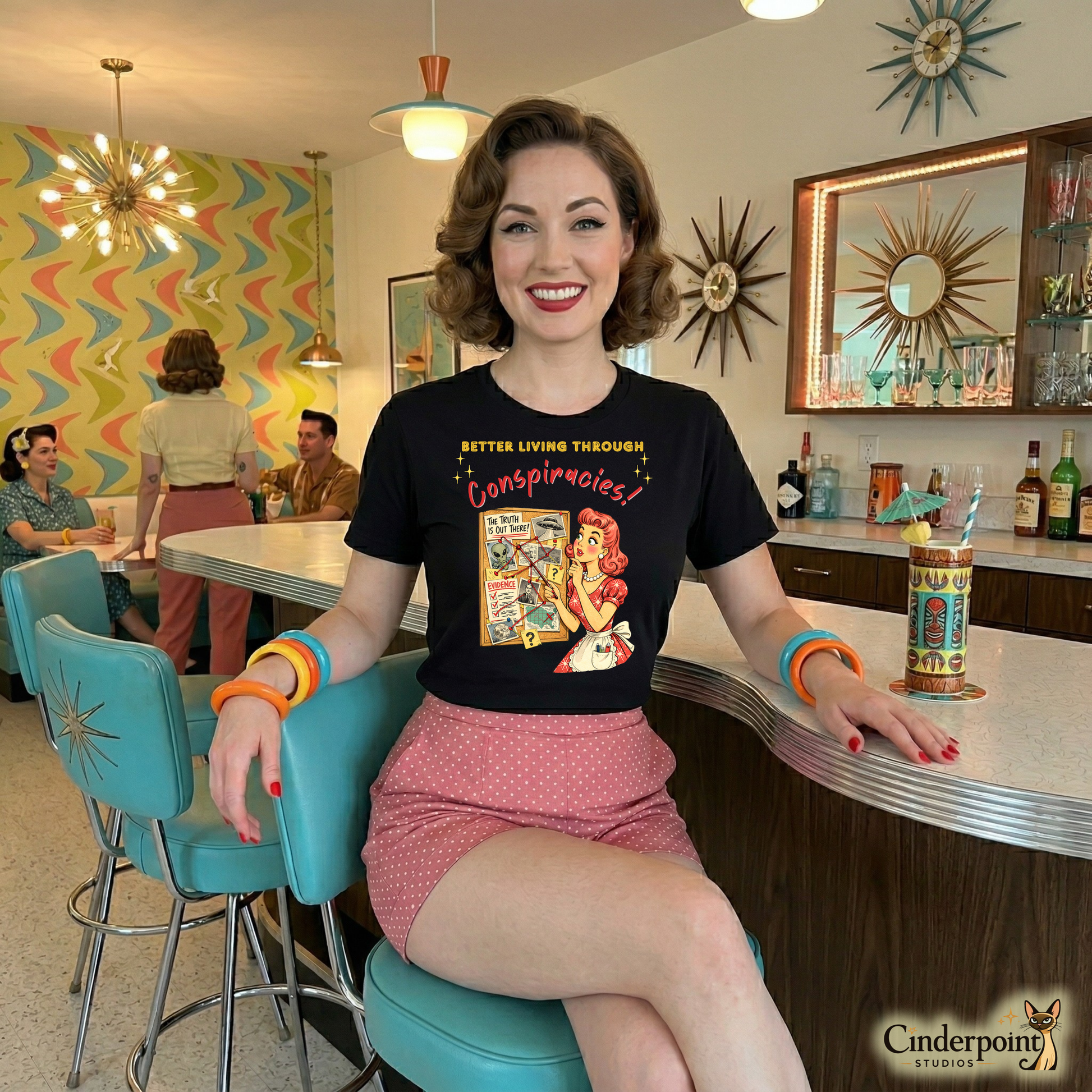 A retro styled woman in an atomic-age diner wearing a Retro watercolor illustration of a 1950s woman in a red dress pointing at a conspiracy corkboard with red string, aliens, and UFO photos on a black t-shirt.