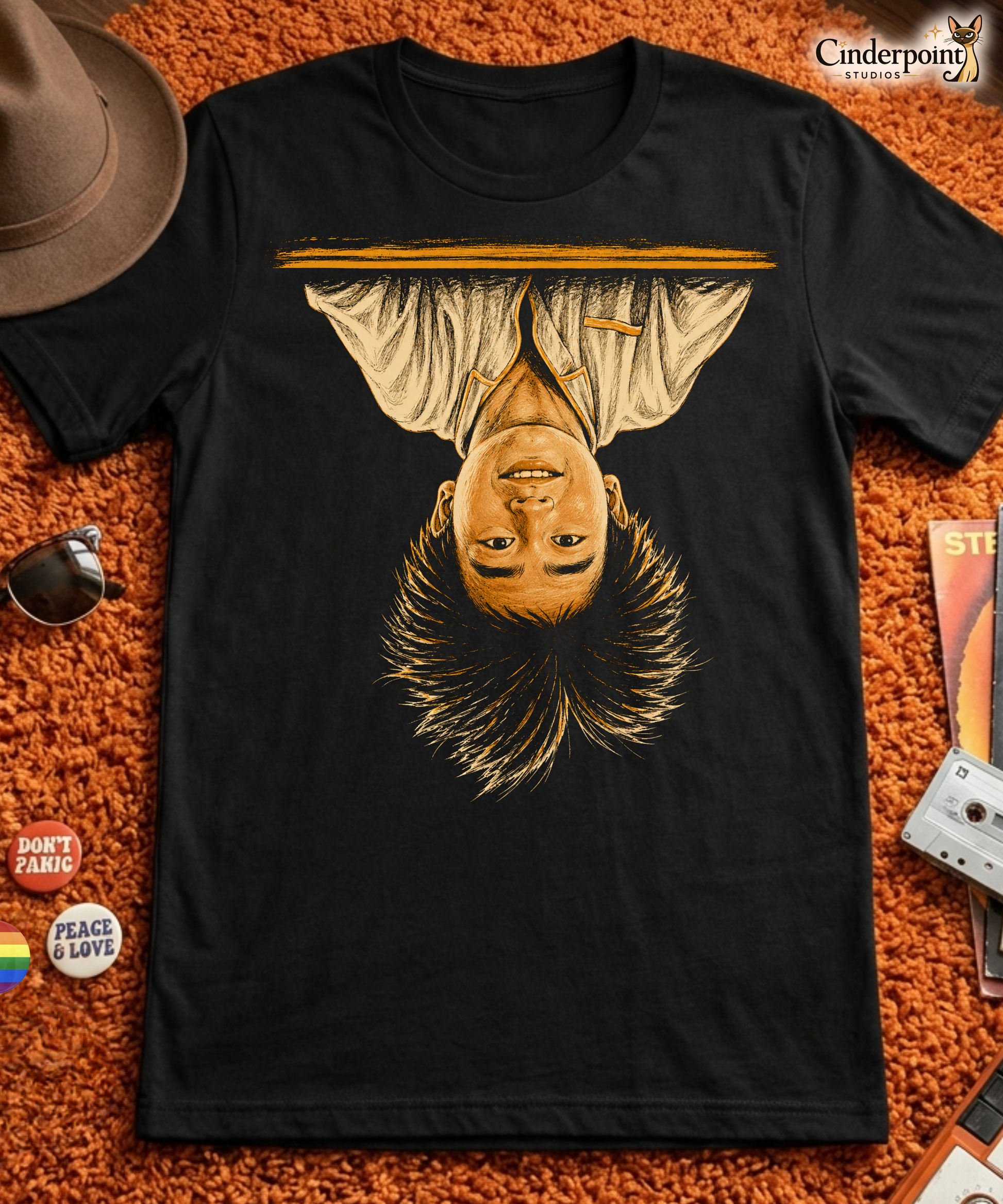 A black t-shirt featuring the iconic image of Long Duk Dong upside down from the scene "What's Happenin Hot Stuff" in the 80s comedy Sixteen Candles.