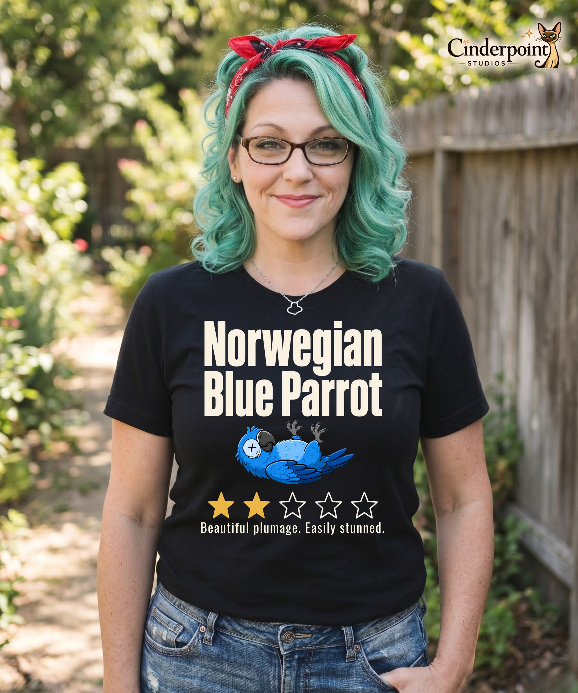 Funny blue parrot t-shirt design with two-star review text reading Beautiful plumage Easily stunned