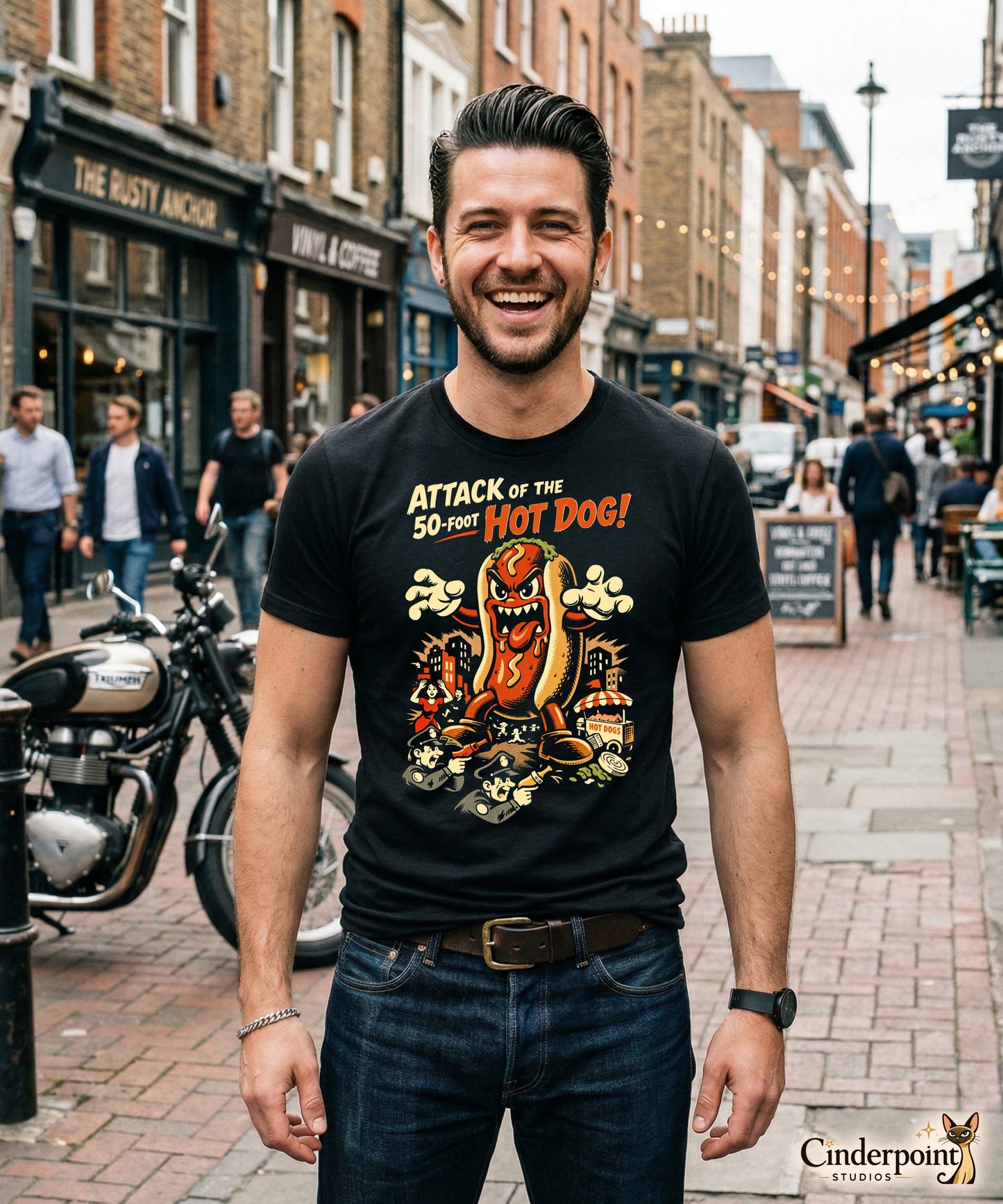A retro B-movie style graphic t-shirt featuring a giant 50-foot hot dog attacking a vintage city skyline, with campy horror-themed cinematic lettering.