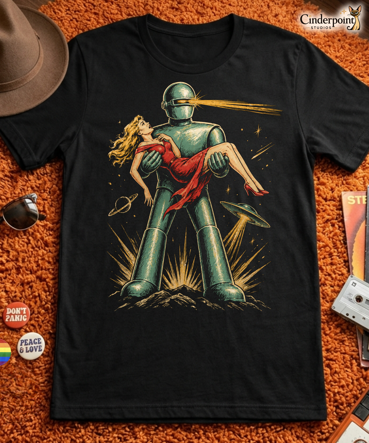 A retro, high-contrast graphic on a black t-shirt featuring the robot Gort from the 1951 film The Day The Earth Stood Still, with a sleek metallic aesthetic