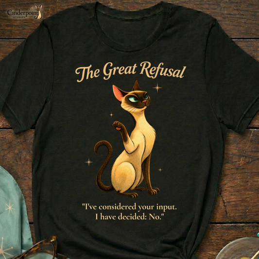 Flat layout on a dark wooden surface. Features a black graphic t-shirt featuring a Siamese cat with his paw up dismissively and is titled "The Great Refusal." Surrounded by an atomic age scarf with snowflake starbursts, cat-eye glasses, swizzle sticks and two martini olives.