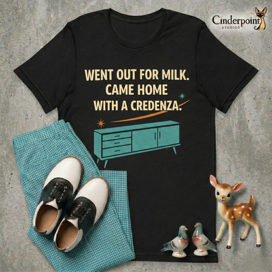 A top-down flat-lay on a grey concrete surface featuring the 'Went Out For Milk' black tee. Included are teal gingham pants, black and white saddle shoes, and vintage ceramic figurines.