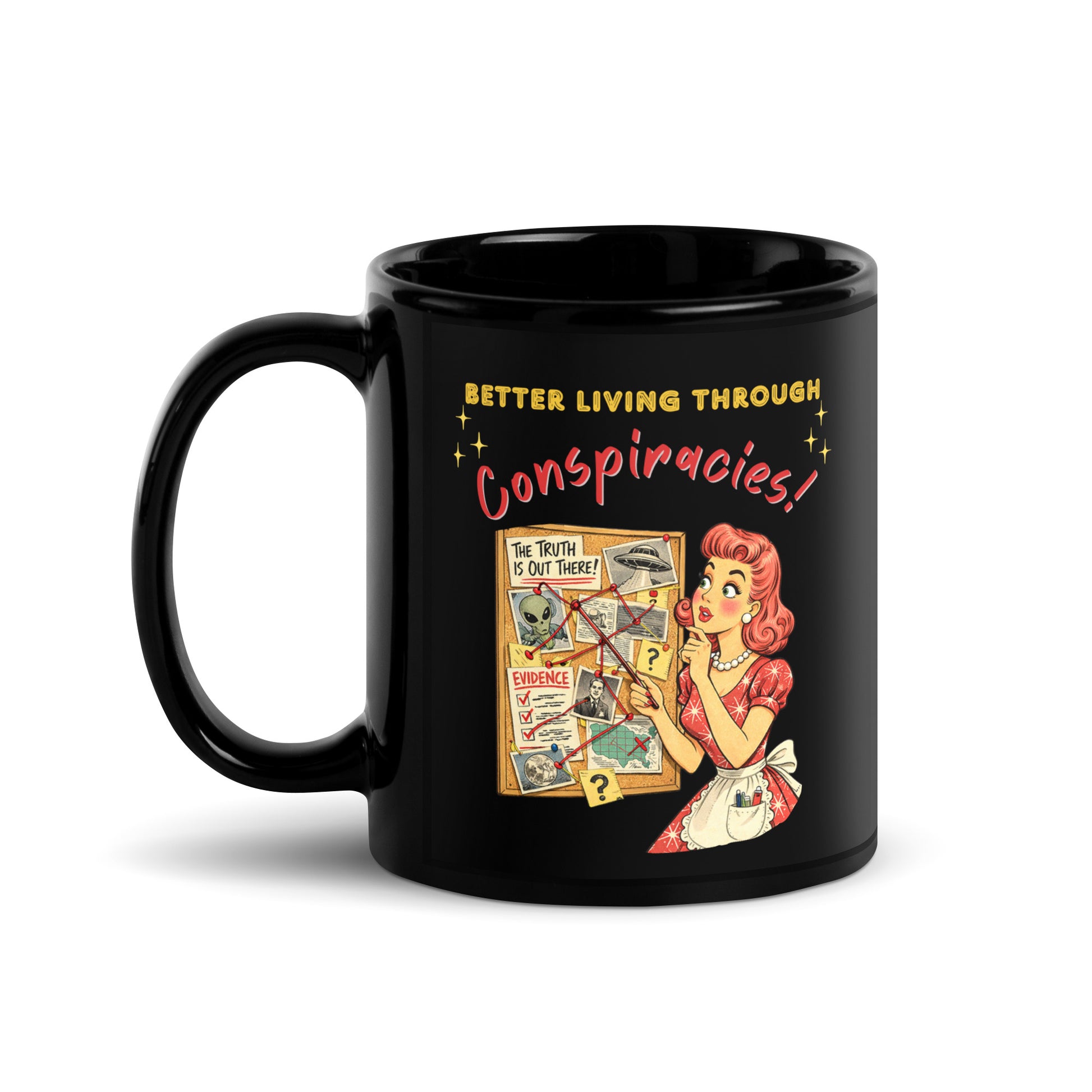 Better Living Through Conspiracies black ceramic mug — vintage 1950s retro housewife pointing at alien evidence cork board with red string and UFO photos, printed on both sides by Cinderpoint Studios