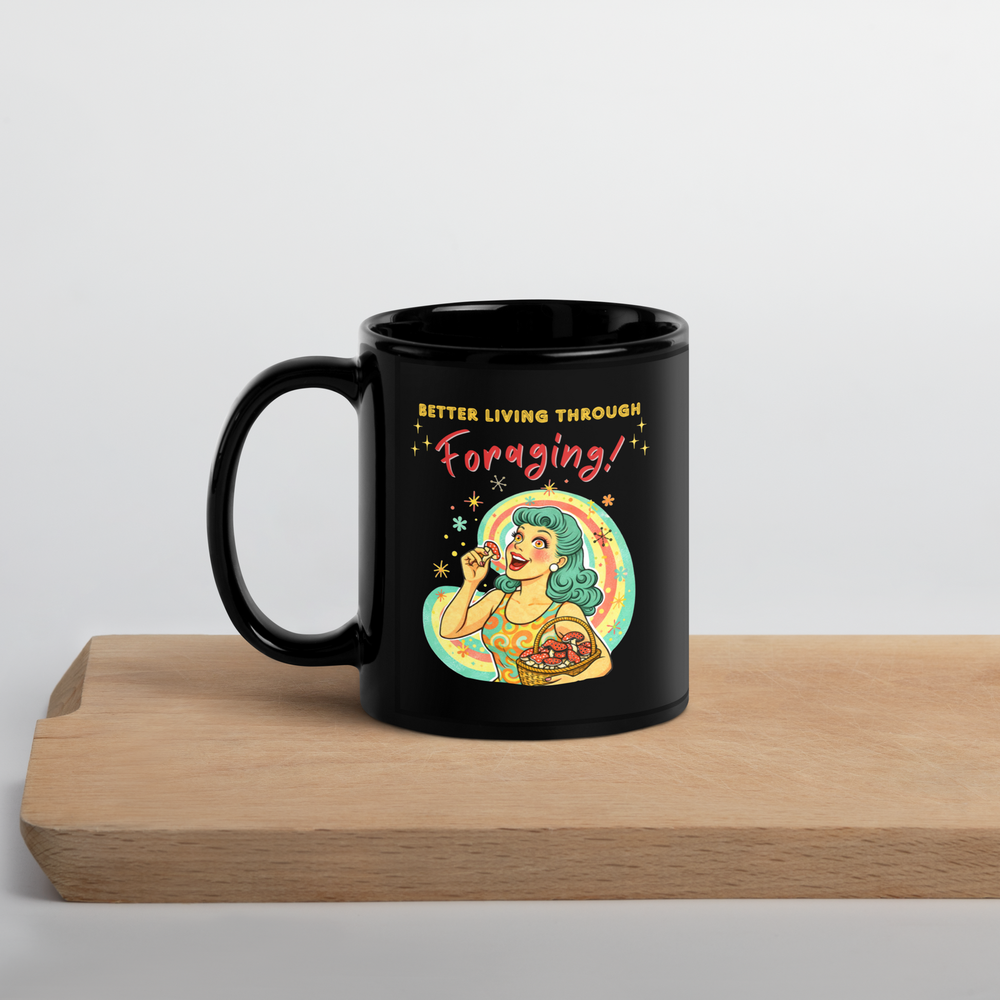 Better Living Through Foraging black ceramic mug — vintage retro housewife with teal hair and glowing eyes holding a red mushroom with basket of foraged mushrooms against rainbow halo, printed on both sides by Cinderpoint Studios