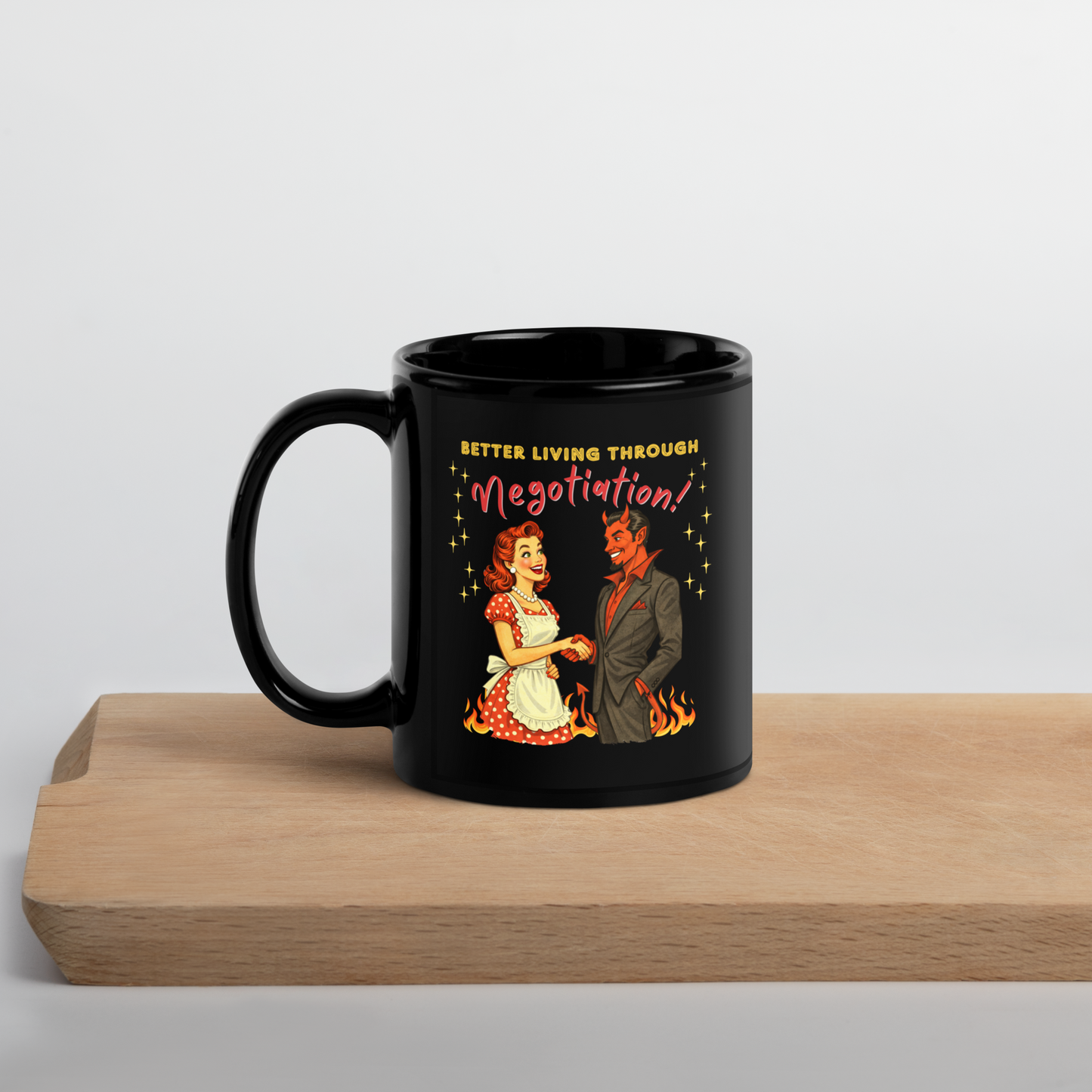 Better Living Through Negotiation black ceramic mug — vintage 1950s retro housewife in polka dot apron confidently shaking hands with a suited Devil amid flames, printed on both sides by Cinderpoint Studios