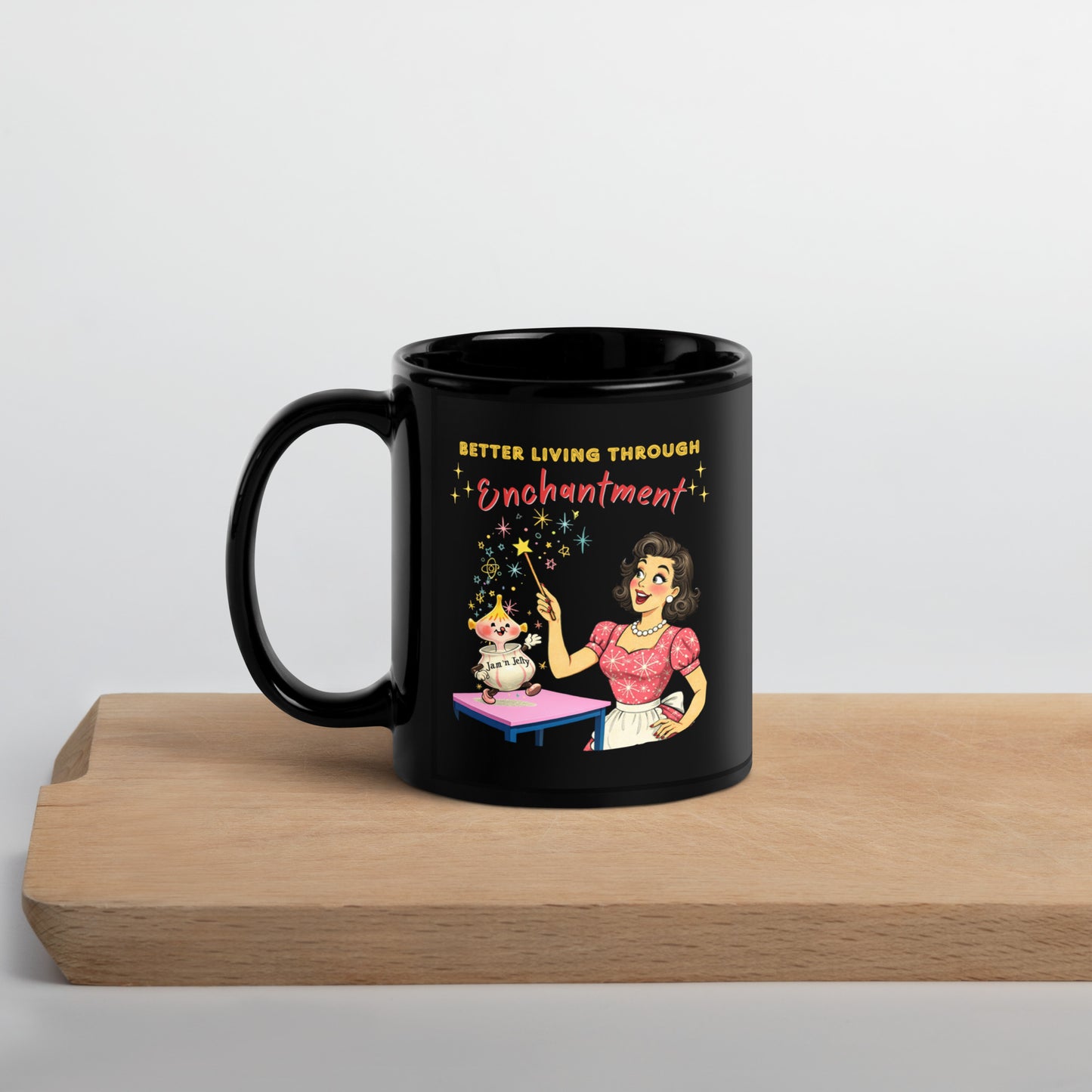 Better Living Through Enchantment black ceramic mug — vintage 1950s retro housewife in atomic snowflake dress pointing a magic wand at an enchanted anthropomorphic Jam n Jelly jar dancing on a pink table, printed on both sides by Cinderpoint Studios