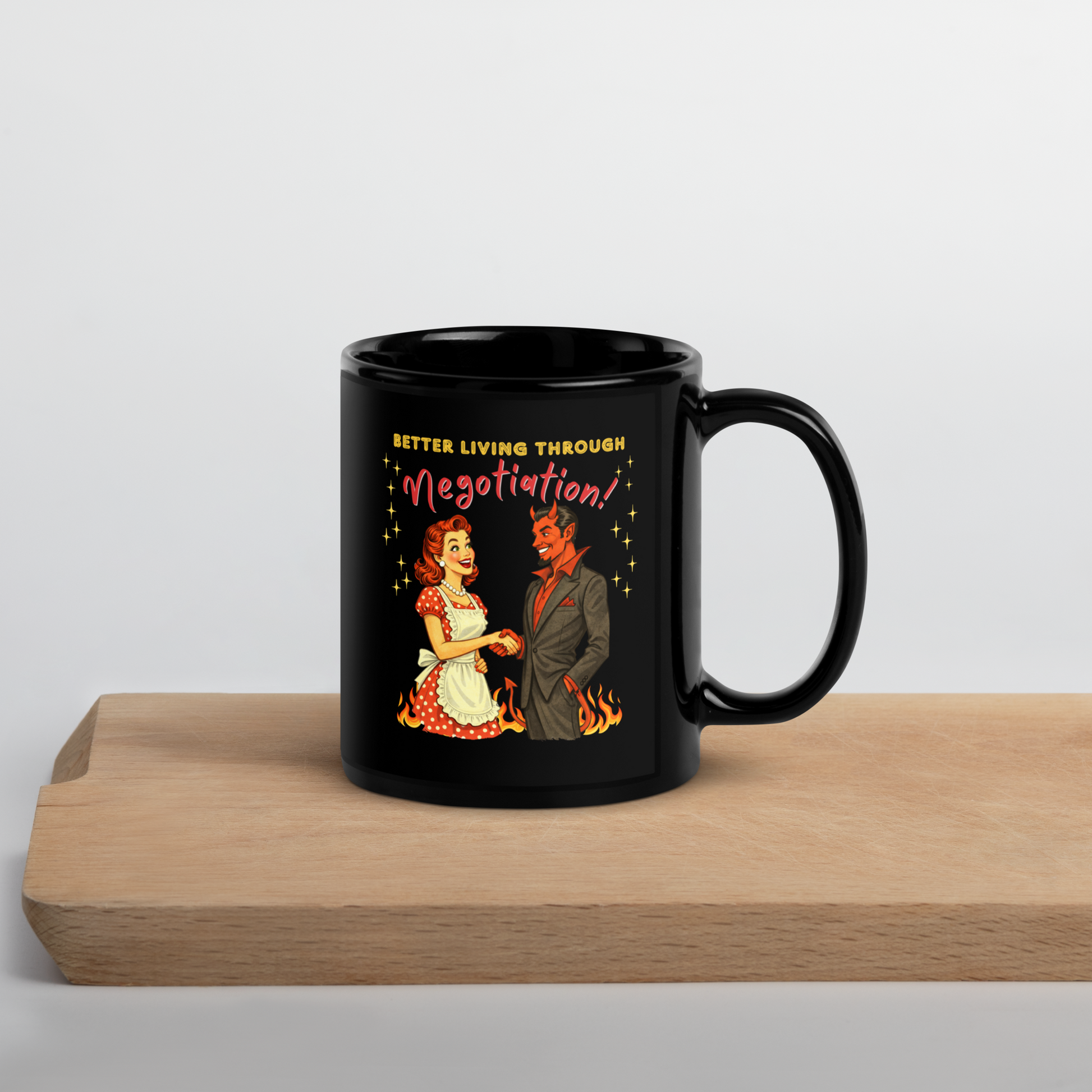 Better Living Through Negotiation black ceramic mug — vintage 1950s retro housewife in polka dot apron confidently shaking hands with a suited Devil amid flames, printed on both sides by Cinderpoint Studios