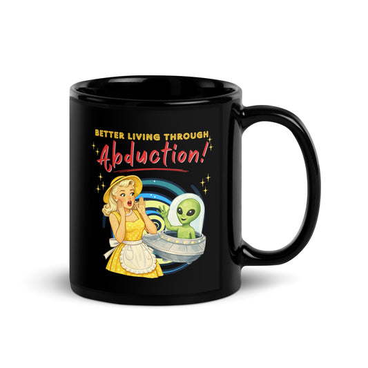 Better Living Through Abduction black ceramic mug — vintage 1950s retro blonde housewife in yellow polka dot dress reacting with delight to a friendly green alien waving from a silver saucer, printed on both sides by Cinderpoint Studios