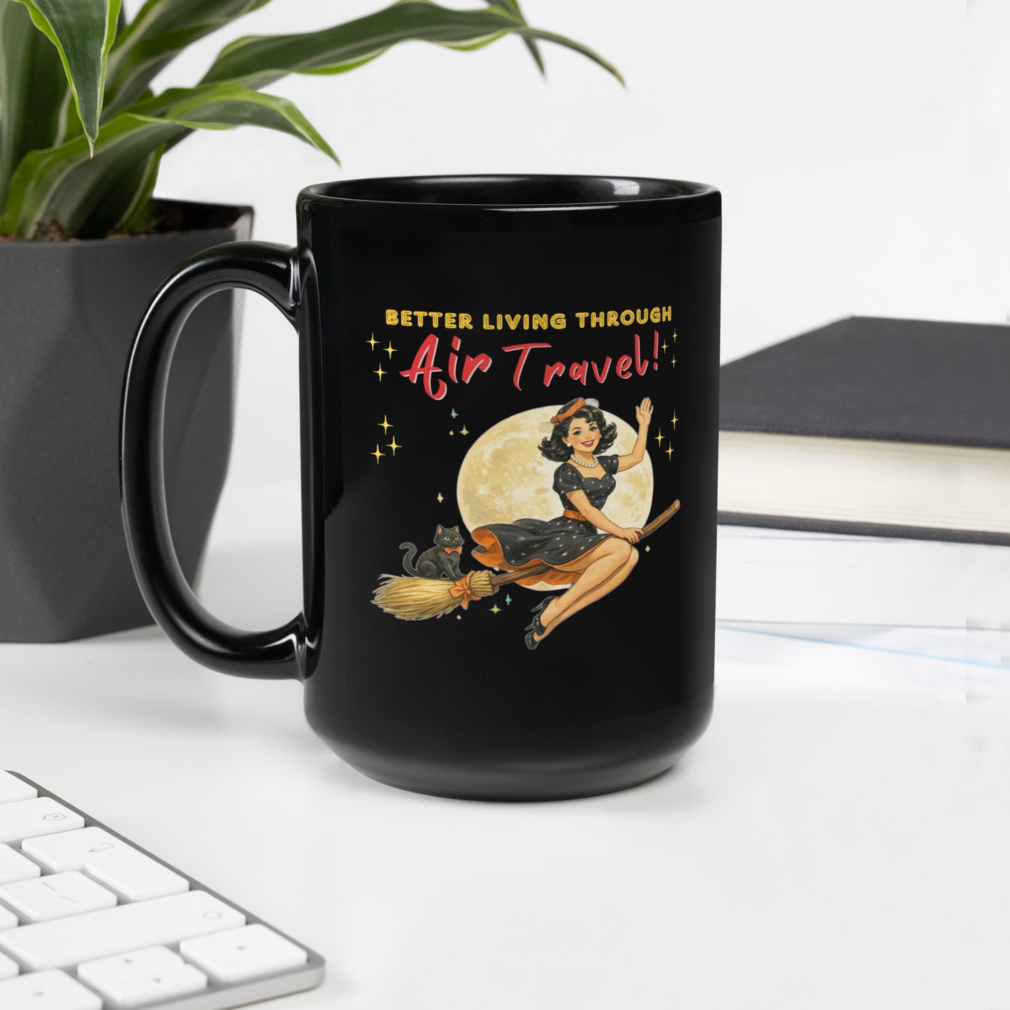 Better Living Through Air Travel black ceramic mug — vintage retro pinup witch in black polka dot dress and stewardess hat riding a broom in front of a full moon with dapper black cat familiar in orange bow tie, printed on both sides by Cinderpoint Studios