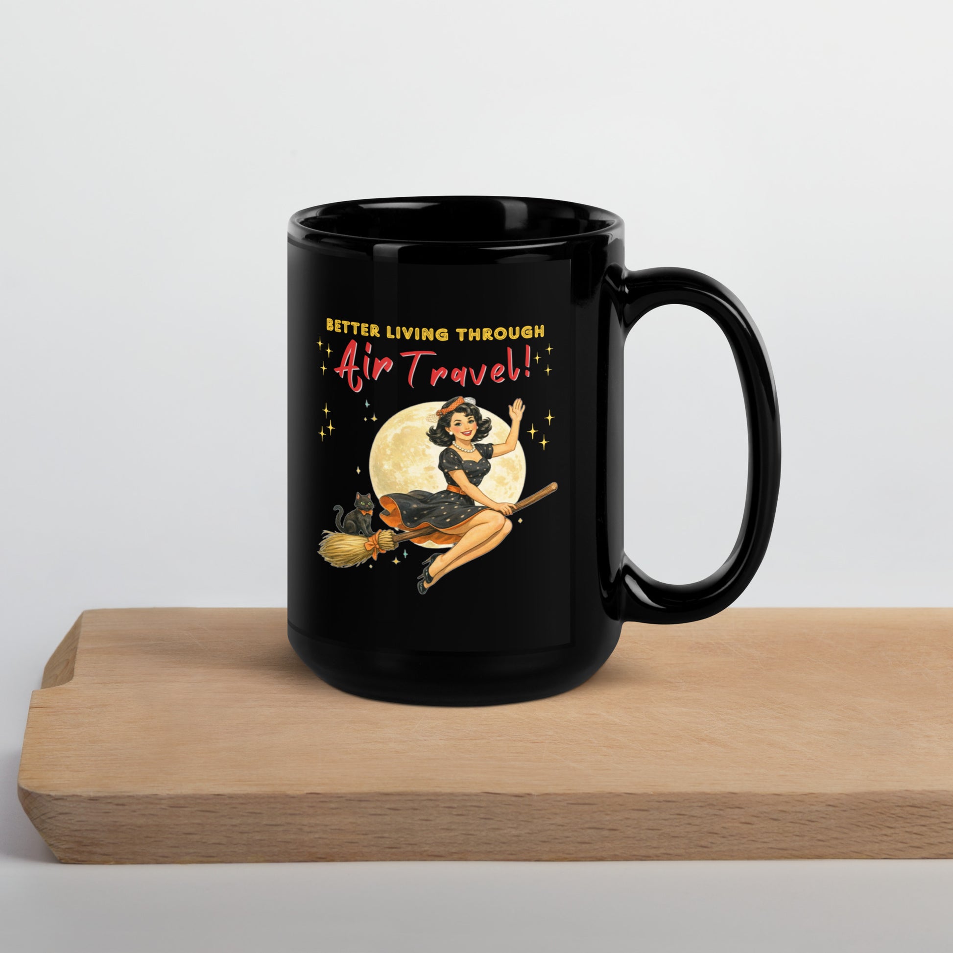 Better Living Through Air Travel black ceramic mug — vintage retro pinup witch in black polka dot dress and stewardess hat riding a broom in front of a full moon with dapper black cat familiar in orange bow tie, printed on both sides by Cinderpoint Studios