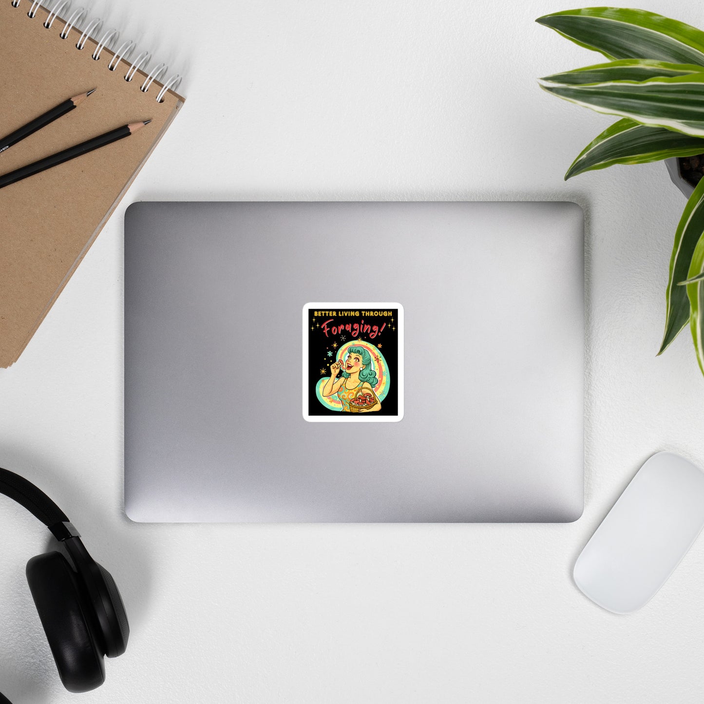 Better Living Through Foraging vinyl decal — vintage retro housewife with teal hair and glowing eyes holding a red mushroom with basket of foraged mushrooms against rainbow halo on black background, satin finish waterproof sticker by Cinderpoint Studios