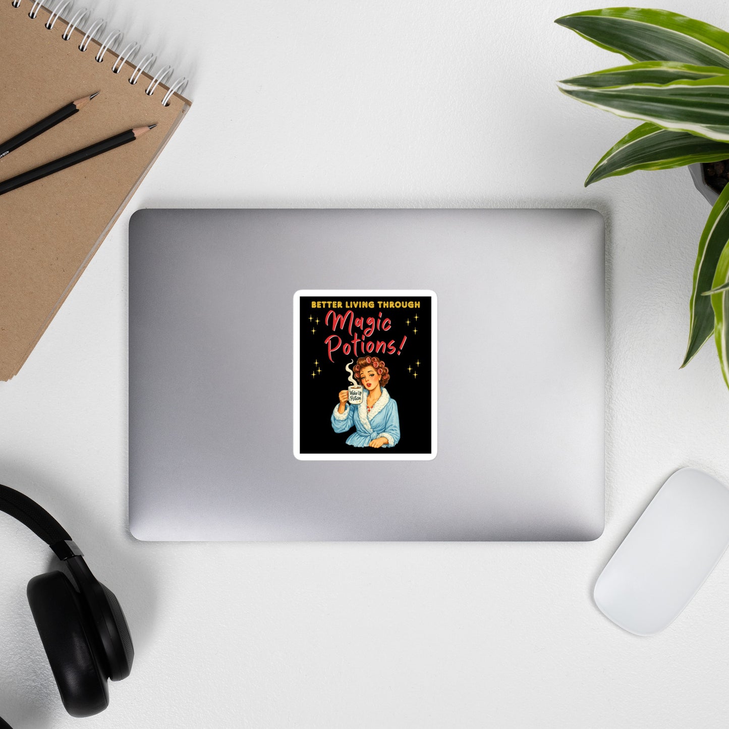 Better Living Through Magic Potions vinyl decal — vintage retro housewife in pink rollers and blue fluffy robe holding a steaming Wake Up Potion mug on black background, satin finish waterproof sticker by Cinderpoint Studios