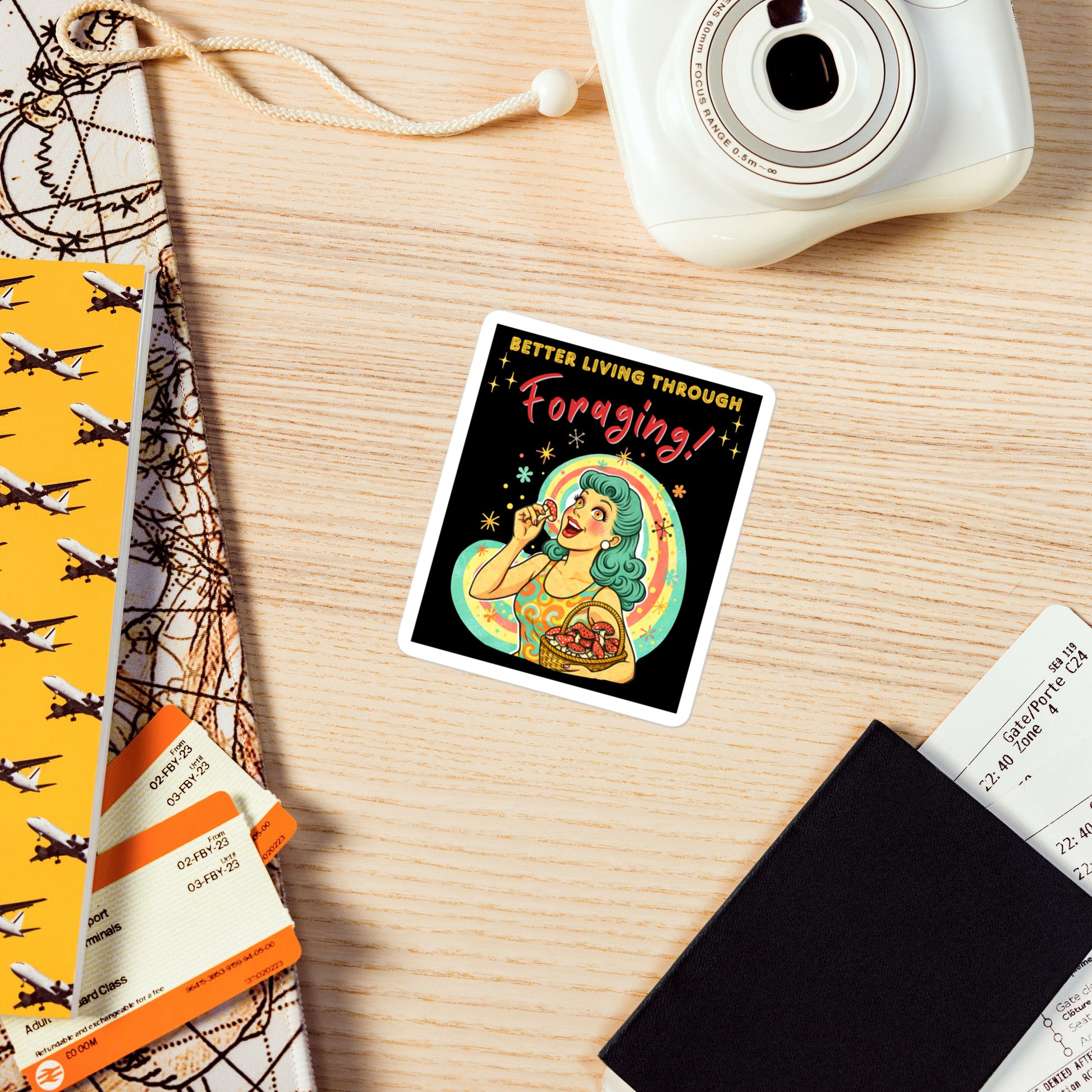 Better Living Through Foraging vinyl decal — vintage retro housewife with teal hair and glowing eyes holding a red mushroom with basket of foraged mushrooms against rainbow halo on black background, satin finish waterproof sticker by Cinderpoint Studios