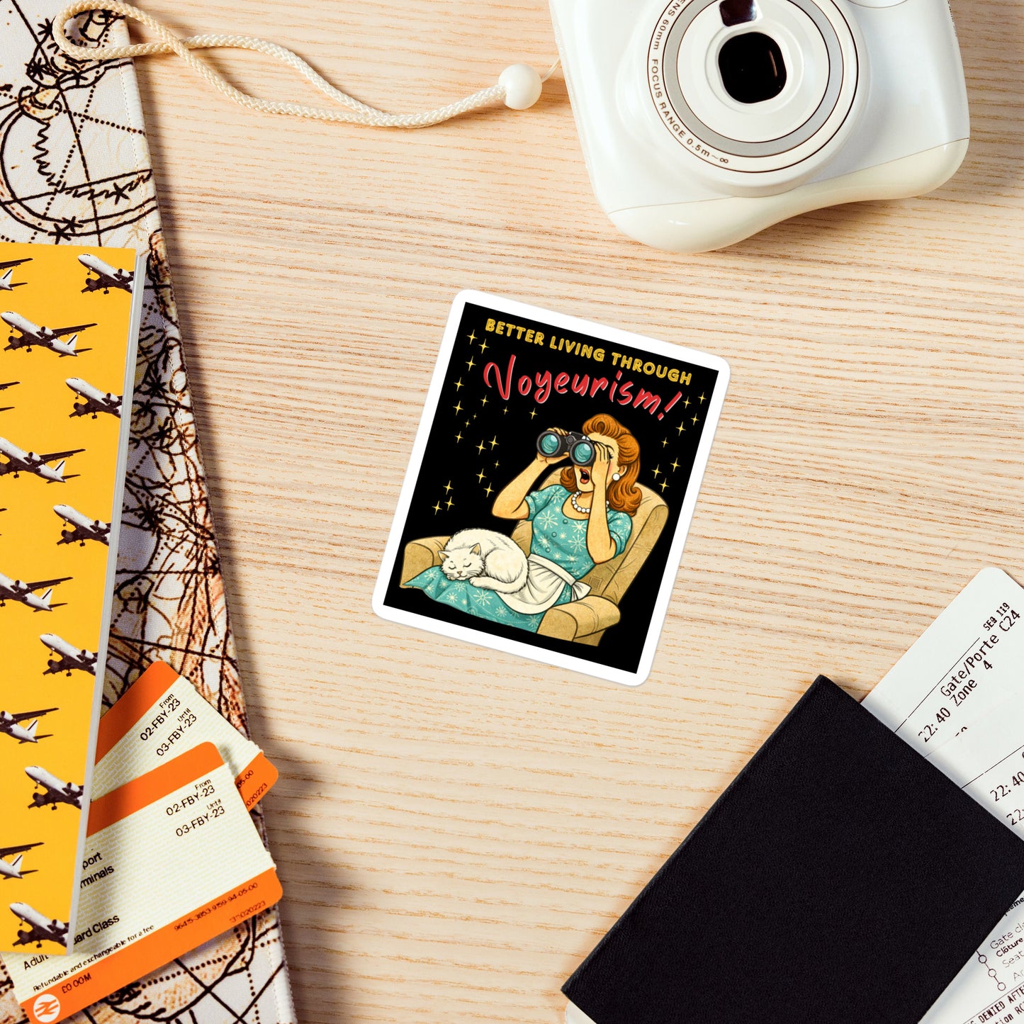 Better Living Through Voyeurism vinyl decal — vintage 1950s retro housewife peering through binoculars with mouth open while white cat sleeps in her lap on black background, satin finish waterproof sticker by Cinderpoint Studios