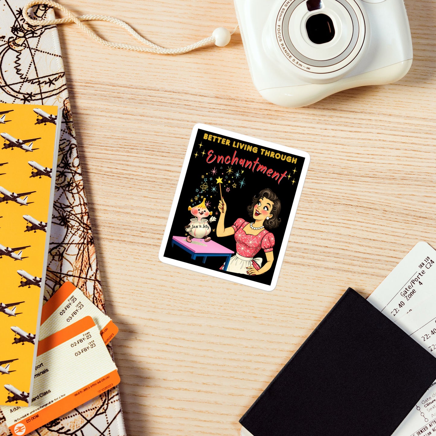Better Living Through Enchantment vinyl decal — vintage 1950s retro housewife in atomic snowflake dress pointing a magic wand at an enchanted anthropomorphic Jam n Jelly jar dancing on a pink table on black background, satin finish waterproof sticker by Cinderpoint Studios
