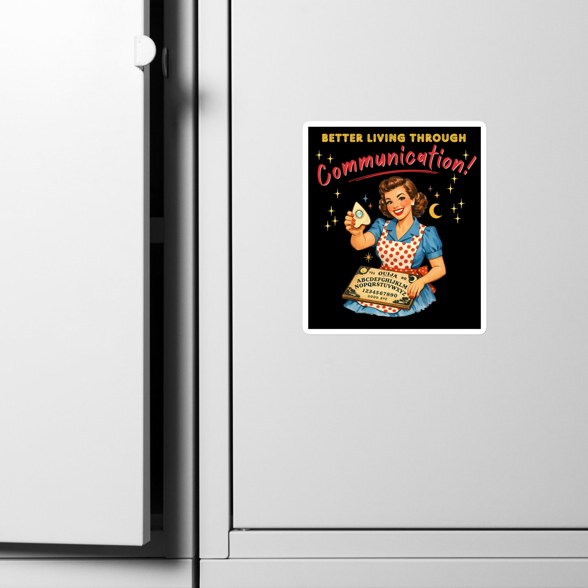 Better Living Through Communication vinyl decal on refrigerator — vintage 1950s retro housewife in polka dot apron holding ouija board and planchette on black background, satin finish waterproof sticker by Cinderpoint Studios