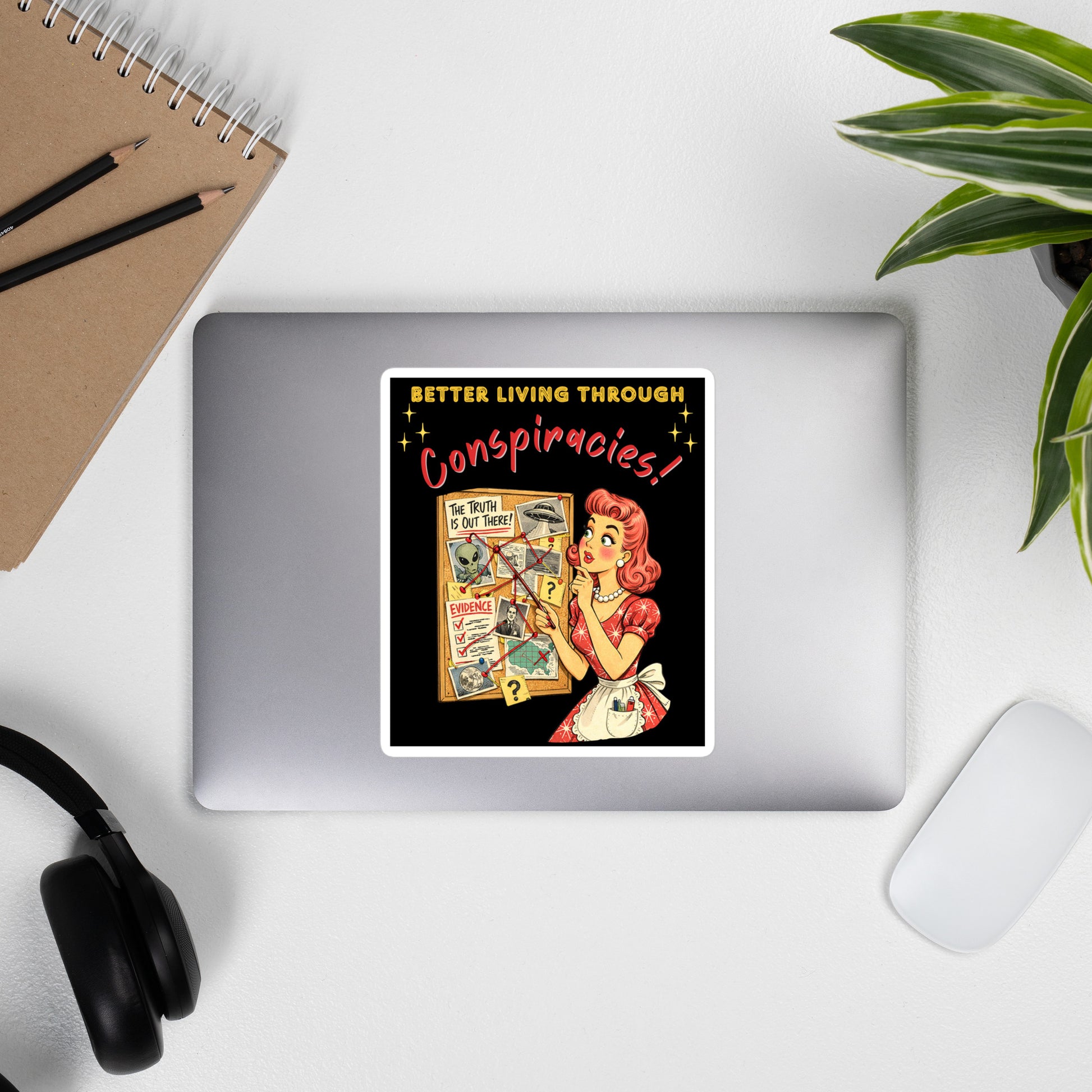 Better Living Through Conspiracies vinyl decal — vintage 1950s retro housewife pointing at alien evidence cork board with red string and UFO photos on black background, satin finish waterproof sticker by Cinderpoint Studios