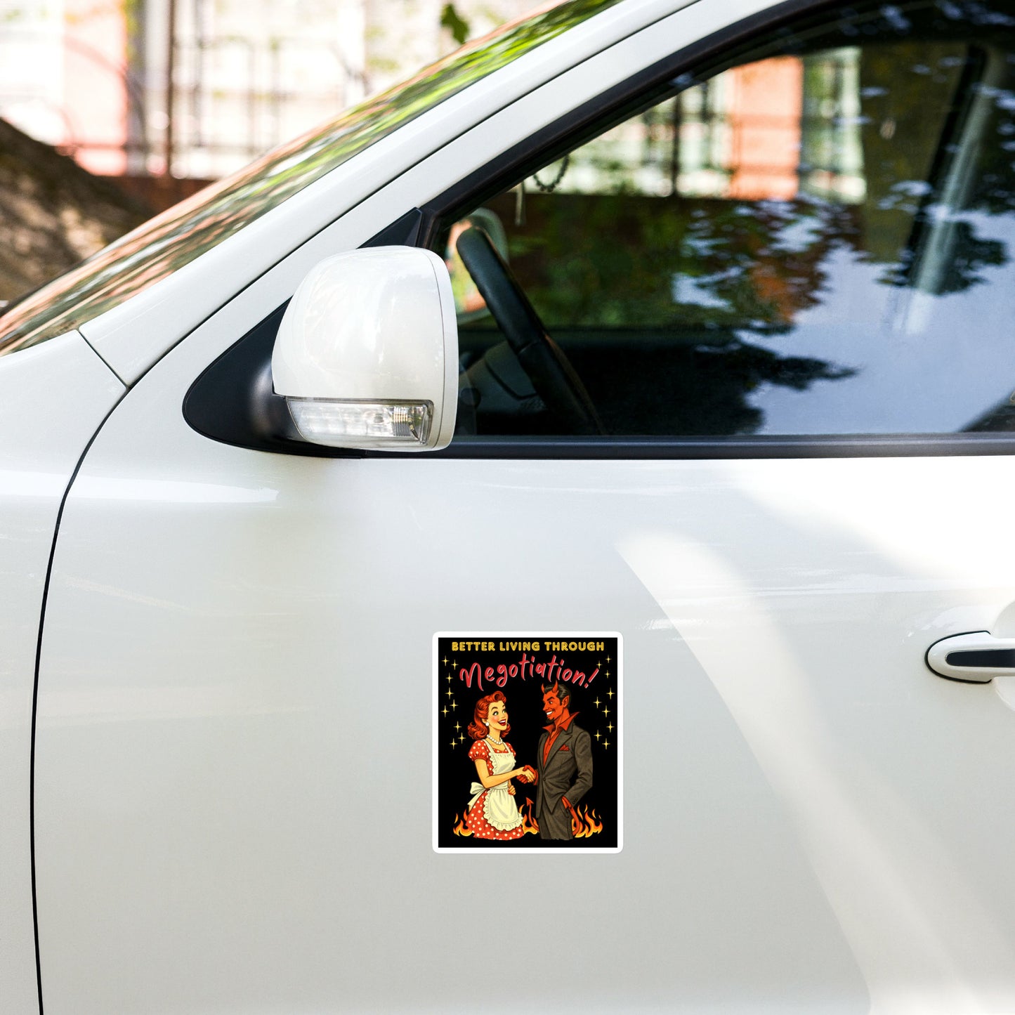 Better Living Through Negotiation vinyl decal — vintage 1950s retro housewife in polka dot apron confidently shaking hands with a suited Devil amid flames on black background, satin finish waterproof sticker by Cinderpoint Studios
