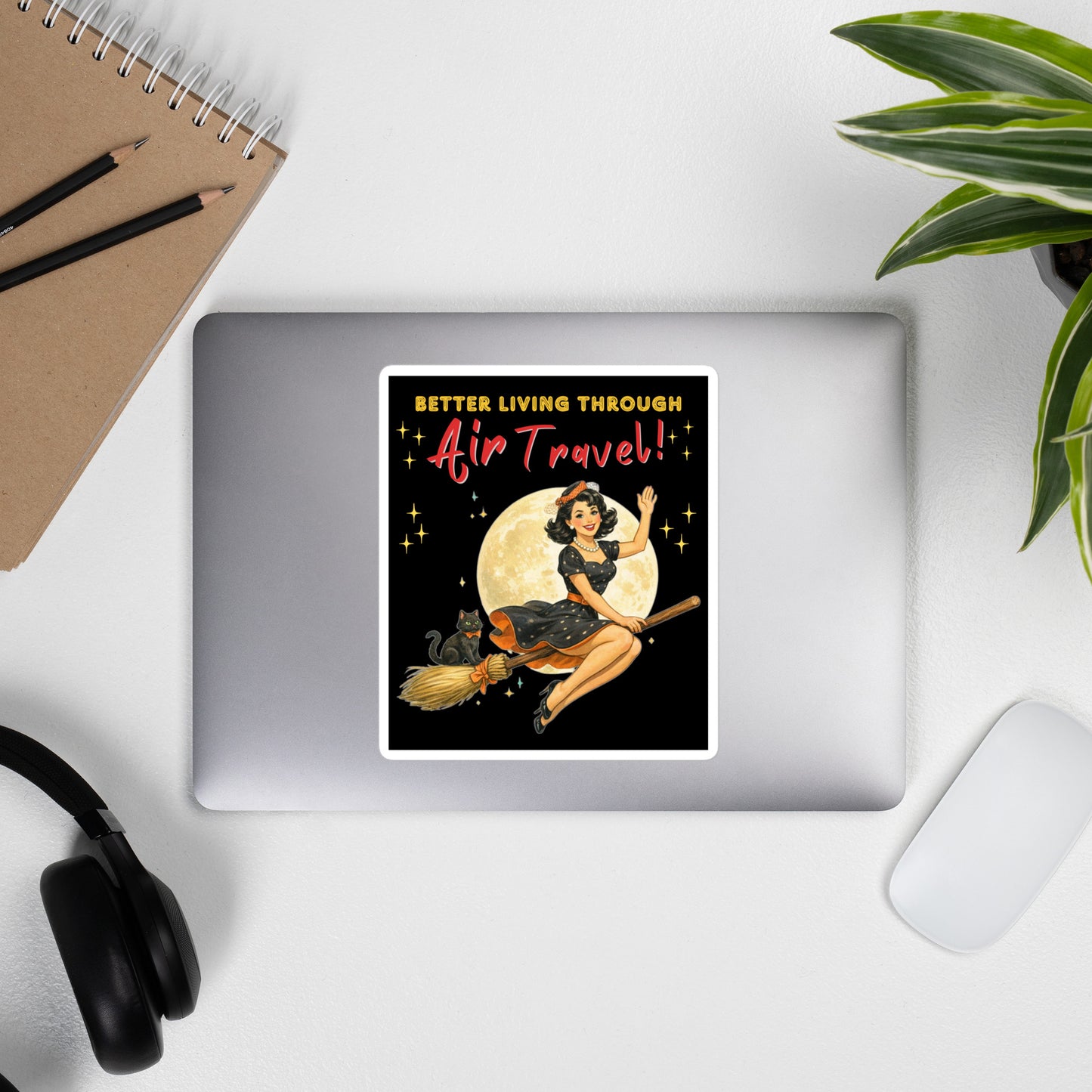 Better Living Through Air Travel vinyl decal — vintage retro pinup witch in black polka dot dress and stewardess hat riding a broom in front of a full moon with dapper black cat familiar in orange bow tie on black background, satin finish waterproof sticker by Cinderpoint Studios