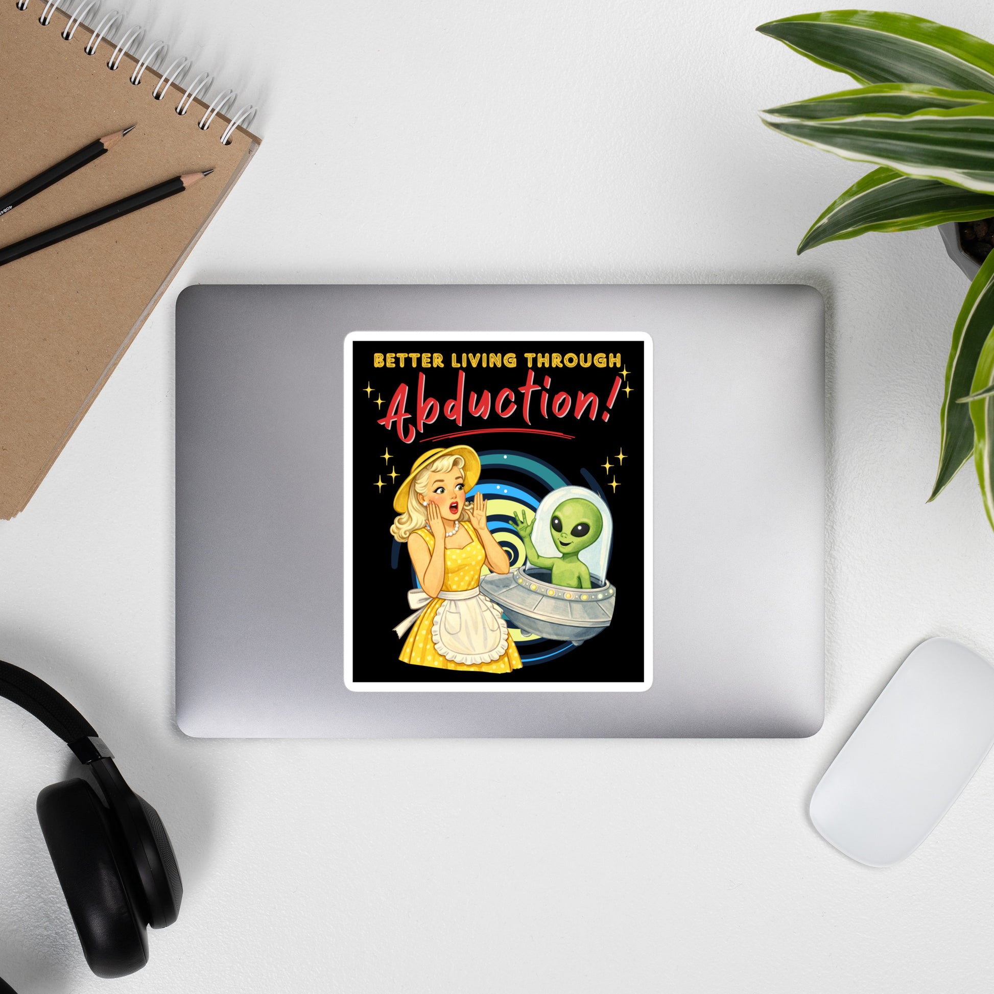 Better Living Through Abduction vinyl decal — vintage 1950s retro blonde housewife in yellow polka dot dress reacting with delight to a friendly green alien waving from a silver saucer on black background, satin finish waterproof sticker by Cinderpoint Studios