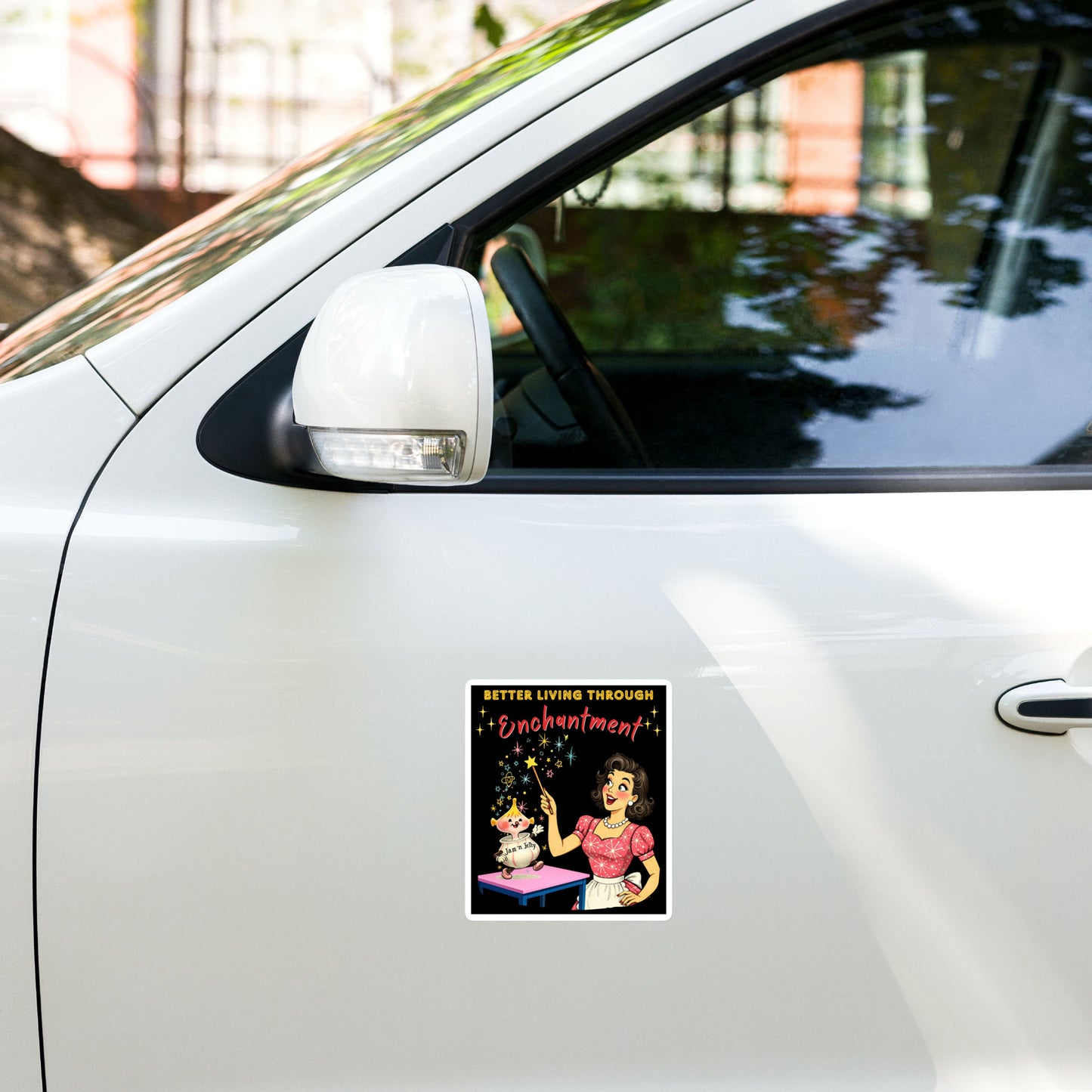 Better Living Through Enchantment vinyl decal — vintage 1950s retro housewife in atomic snowflake dress pointing a magic wand at an enchanted anthropomorphic Jam n Jelly jar dancing on a pink table on black background, satin finish waterproof sticker by Cinderpoint Studios