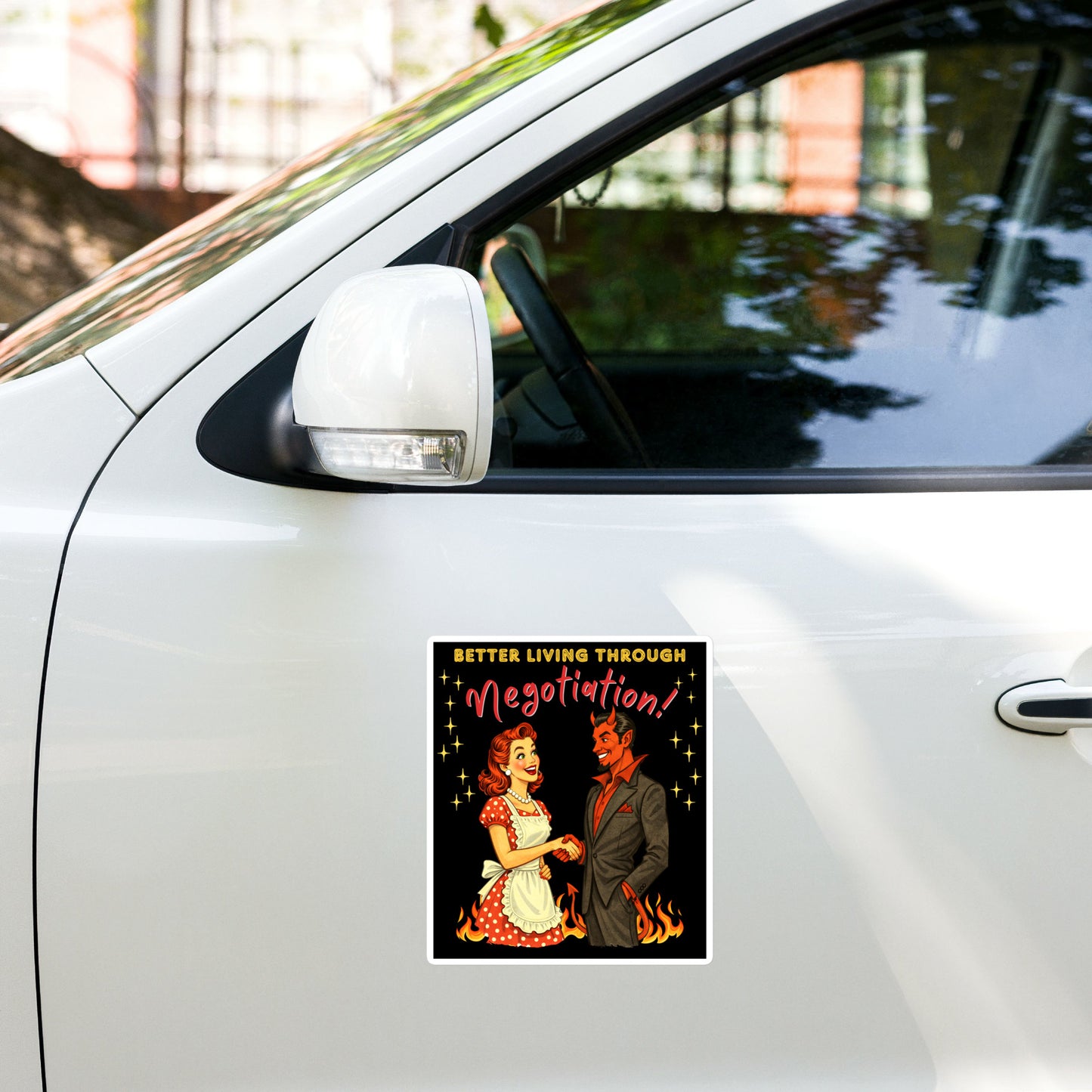 Better Living Through Negotiation vinyl decal — vintage 1950s retro housewife in polka dot apron confidently shaking hands with a suited Devil amid flames on black background, satin finish waterproof sticker by Cinderpoint Studios