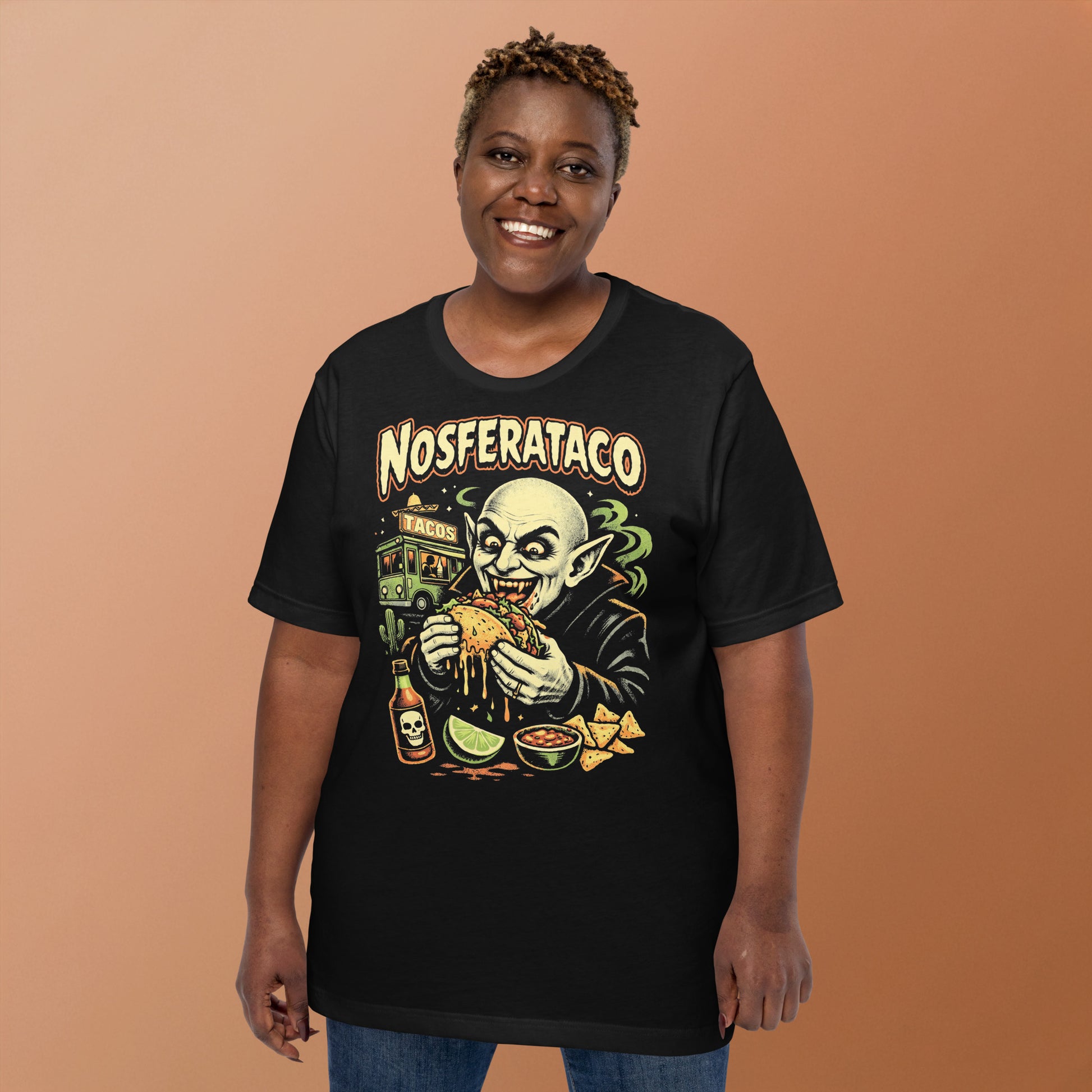A retro horror-style graphic t-shirt featuring the vampire Nosferatu holding a taco, with "Nosferataco" in stylized, campy cinematic lettering.