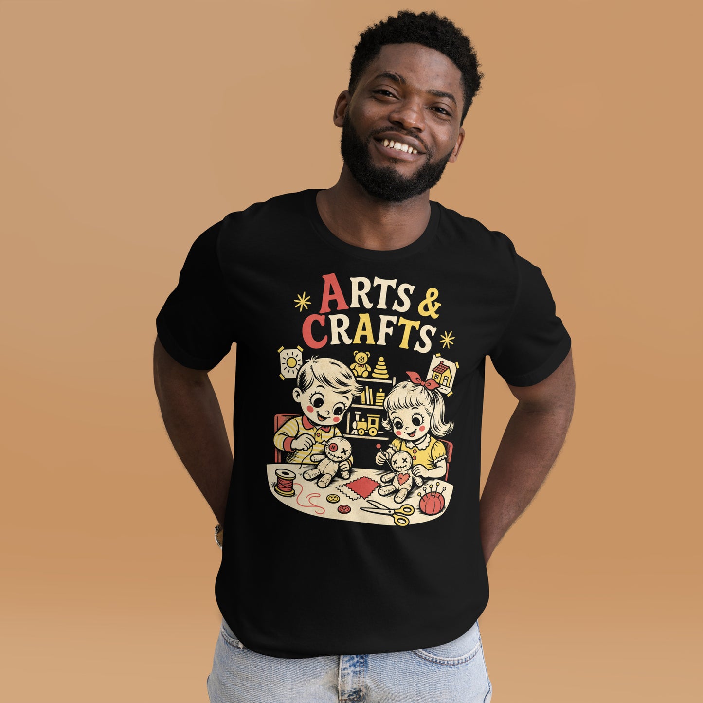 A retro-style graphic t-shirt featuring a creepy-cute voodoo doll with "Arts & Crafts" in stylized, vintage-inspired lettering, perfect for dark humor and goth fans.