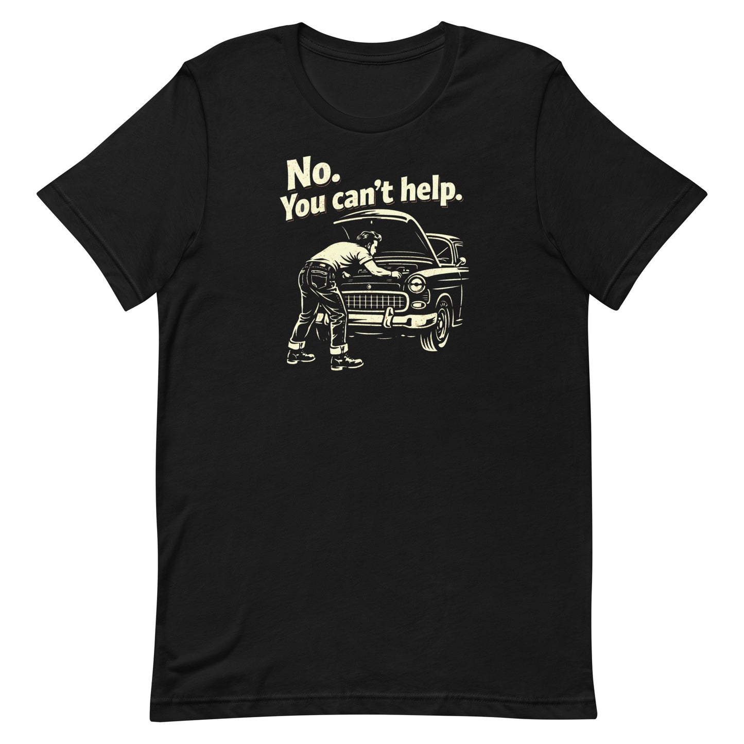 A top-down photograph of a black t-shirt featuring a cream-colored distressed graphic of a man working under a car hood with the text "No. You Can't Help."