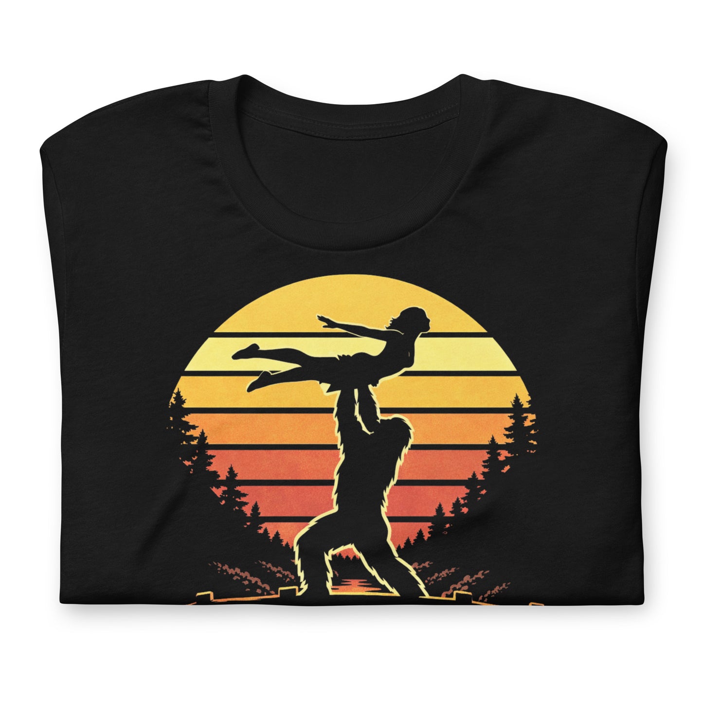 A retro-style graphic t-shirt featuring the cryptid Bigfoot performing the iconic Dirty Dancing lift pose against a vibrant, multi-colored 80s sunburst background.